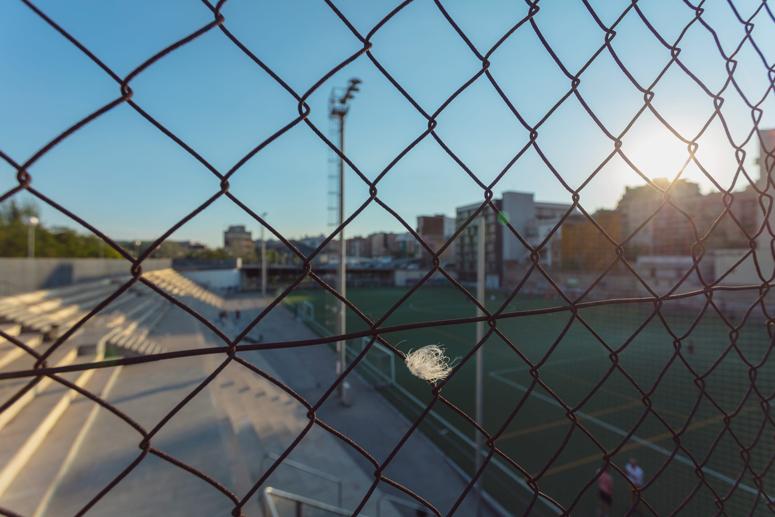 soccer, water, city, fence, focus on foreground, sky, protection, barcelona, building exterior, architecture, barrier, escola de futbol pont marina, security, HD Wallpaper