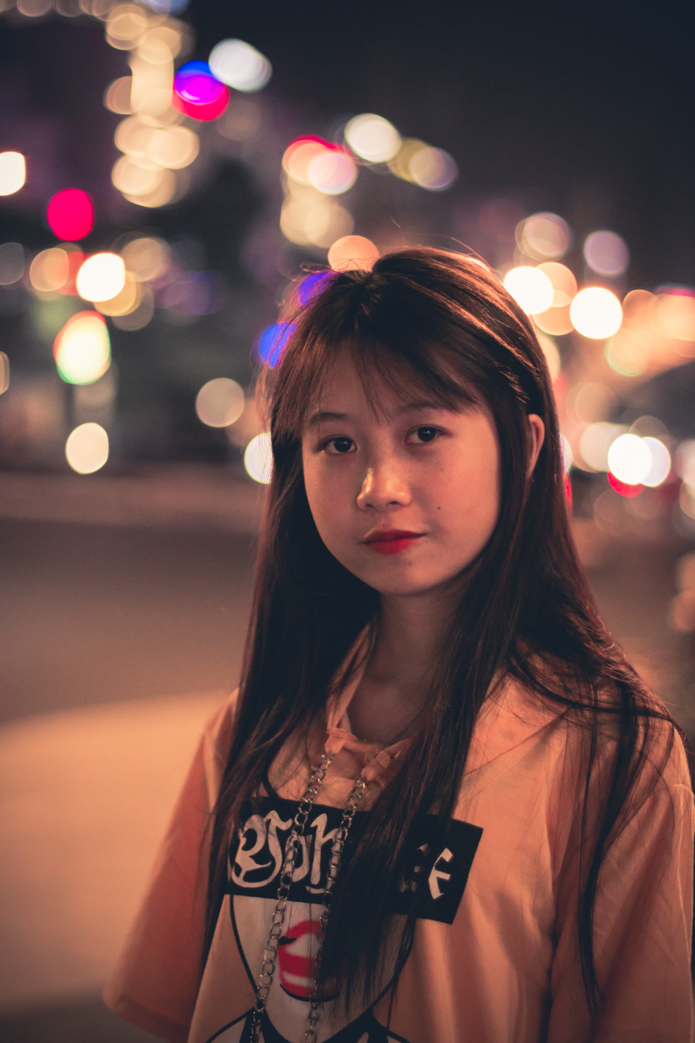 blur, headshot, black, illuminated, lovely, photography, beside, beautiful, focus on foreground, hairstyle, front view, young women, bokeh, 4K, person, Phone HD Wallpaper