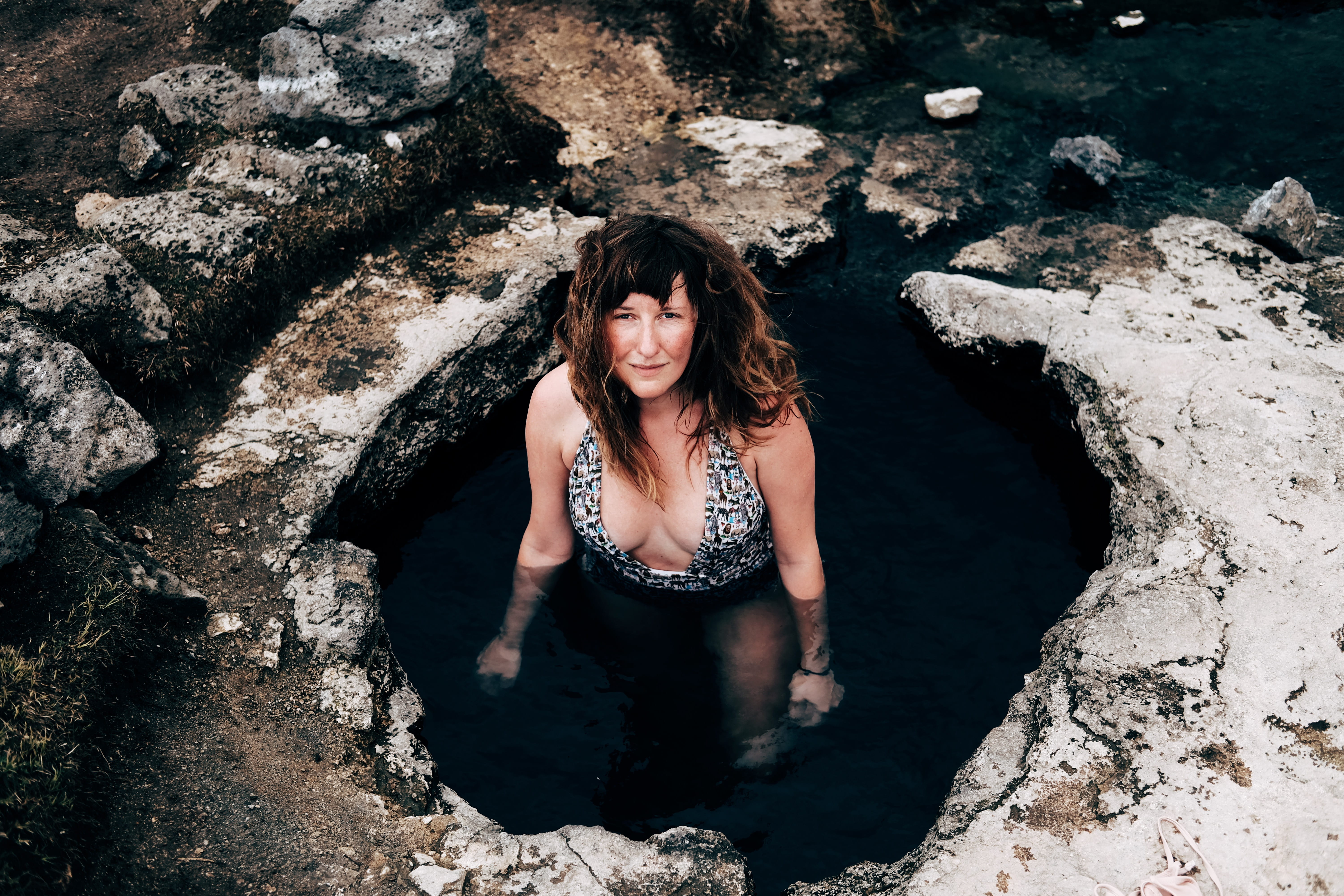 people, women, caucasian Ethnicity, cave, one woman only, daytime, swimming, rock - Object, monokini, water hole, long hair, high angle view, nature, front view, HD Wallpaper