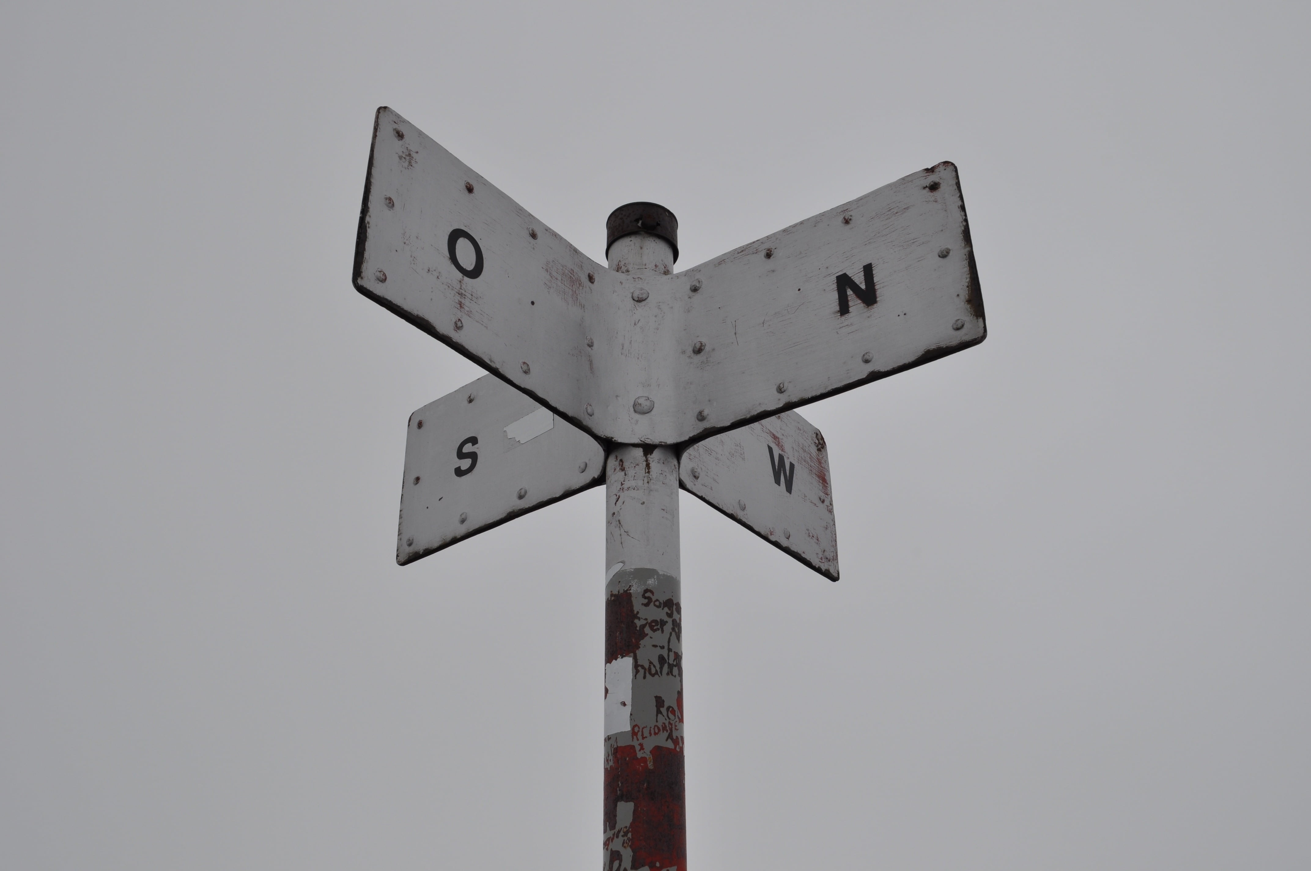 no people, direction, metal, rusty, fog, street, railroad crossing, compass point, directional sign, white color, sign, crossing sign, guidance, nature, HD Wallpaper