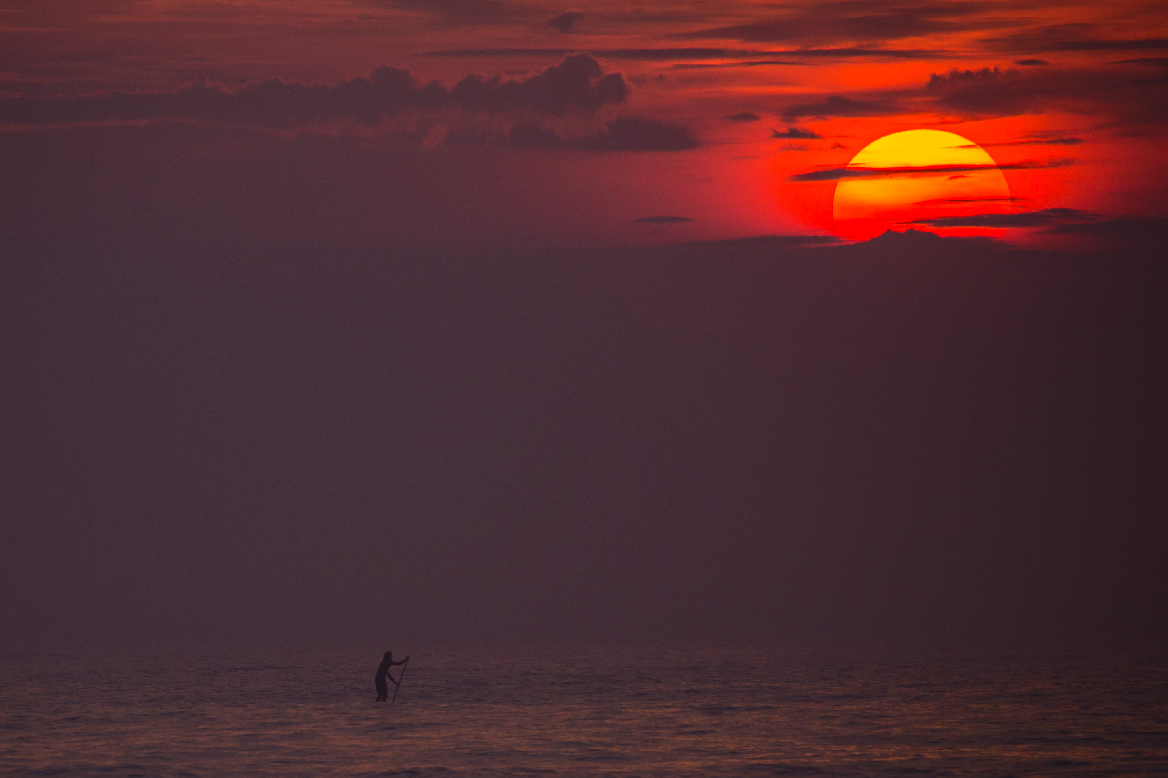 silhouette, plage du petit bec, sun, beauty in nature, sunset, outdoors, cloud - sky, romantic sky, nature, surf, sea, stand-up paddle, sky, orange color, HD Wallpaper