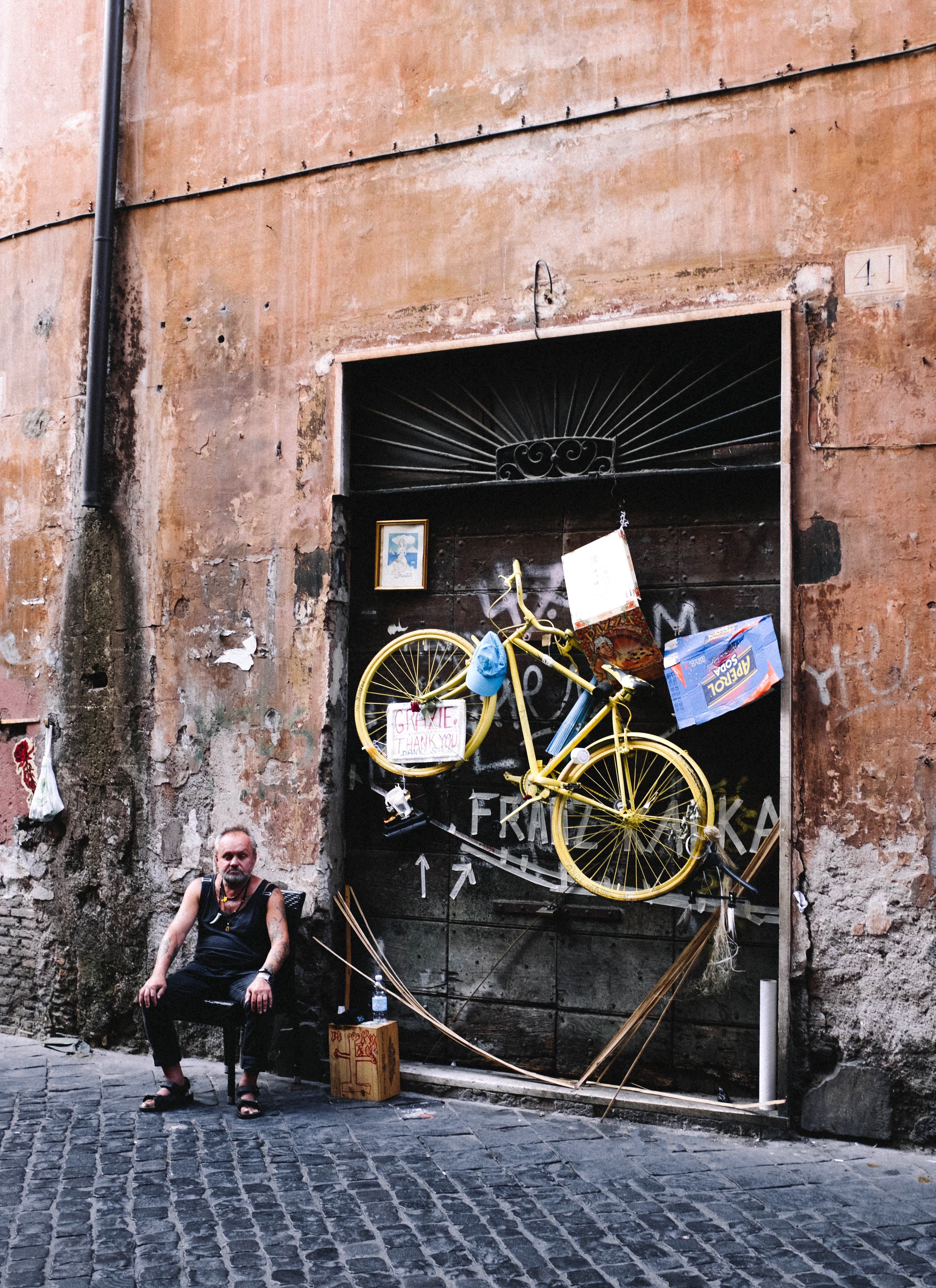 day, outdoors, standing, young adult, architecture, chair, men, sitting, real people, cobbled road, building exterior, built structure, transportation, Phone HD Wallpaper