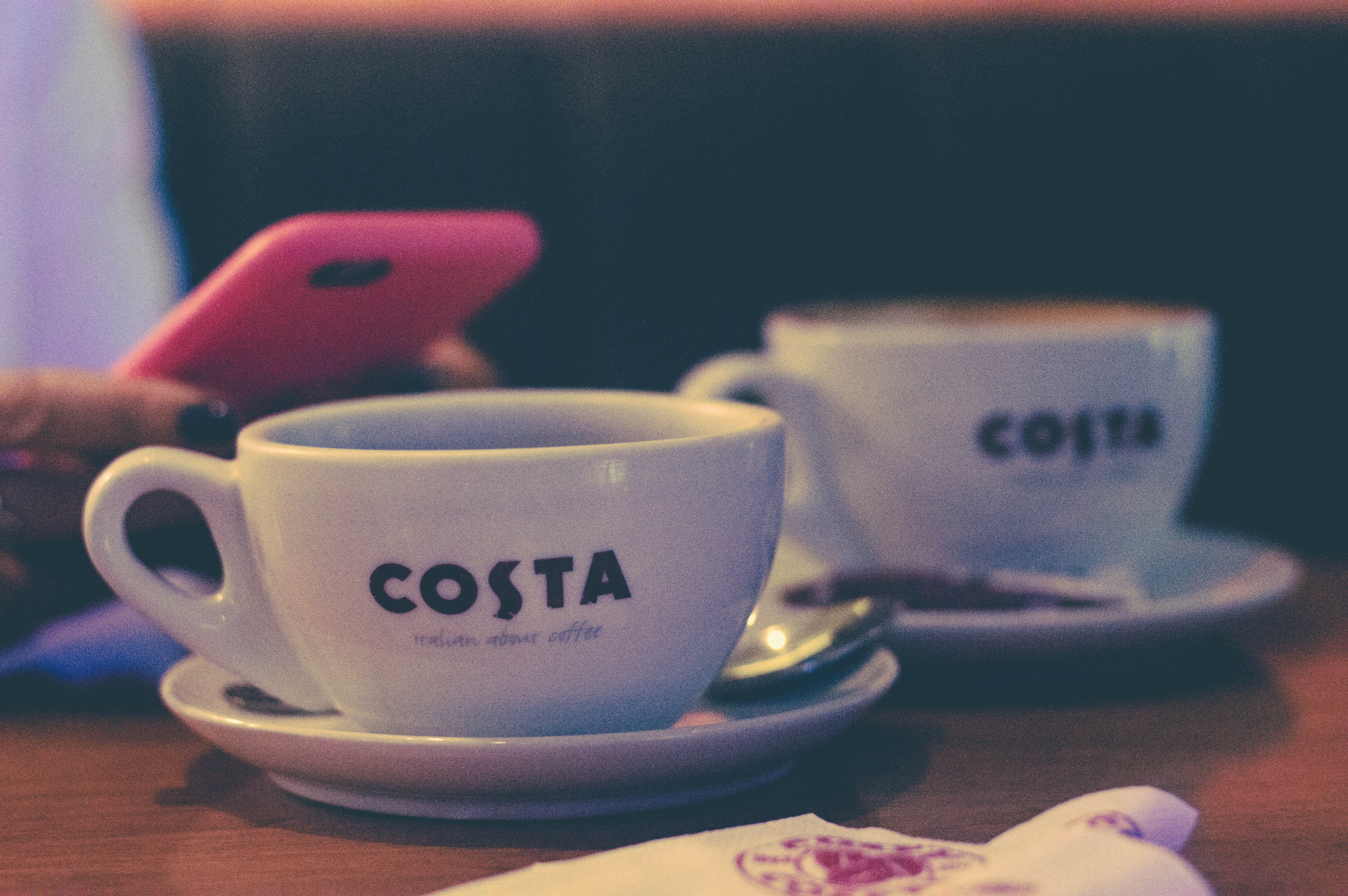 5K, still life, food and drink, phone, company, costa, text, table, drink, cafe, close-up, refreshment, starbucks, coffee, india, costa coffee, crockery, HD Wallpaper