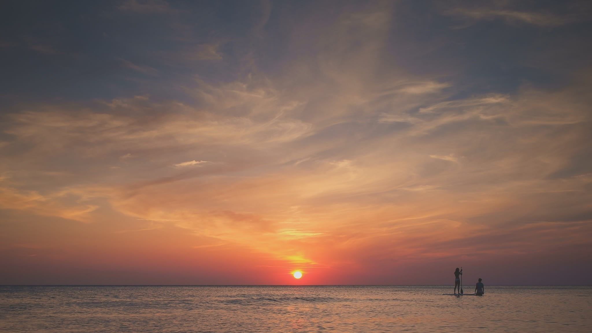 orange color, non-urban scene, sea, stand up paddling, sun, outdoors, water, sup, swimming, two people, paddleboarding, scenics - nature, togetherness, HD Wallpaper