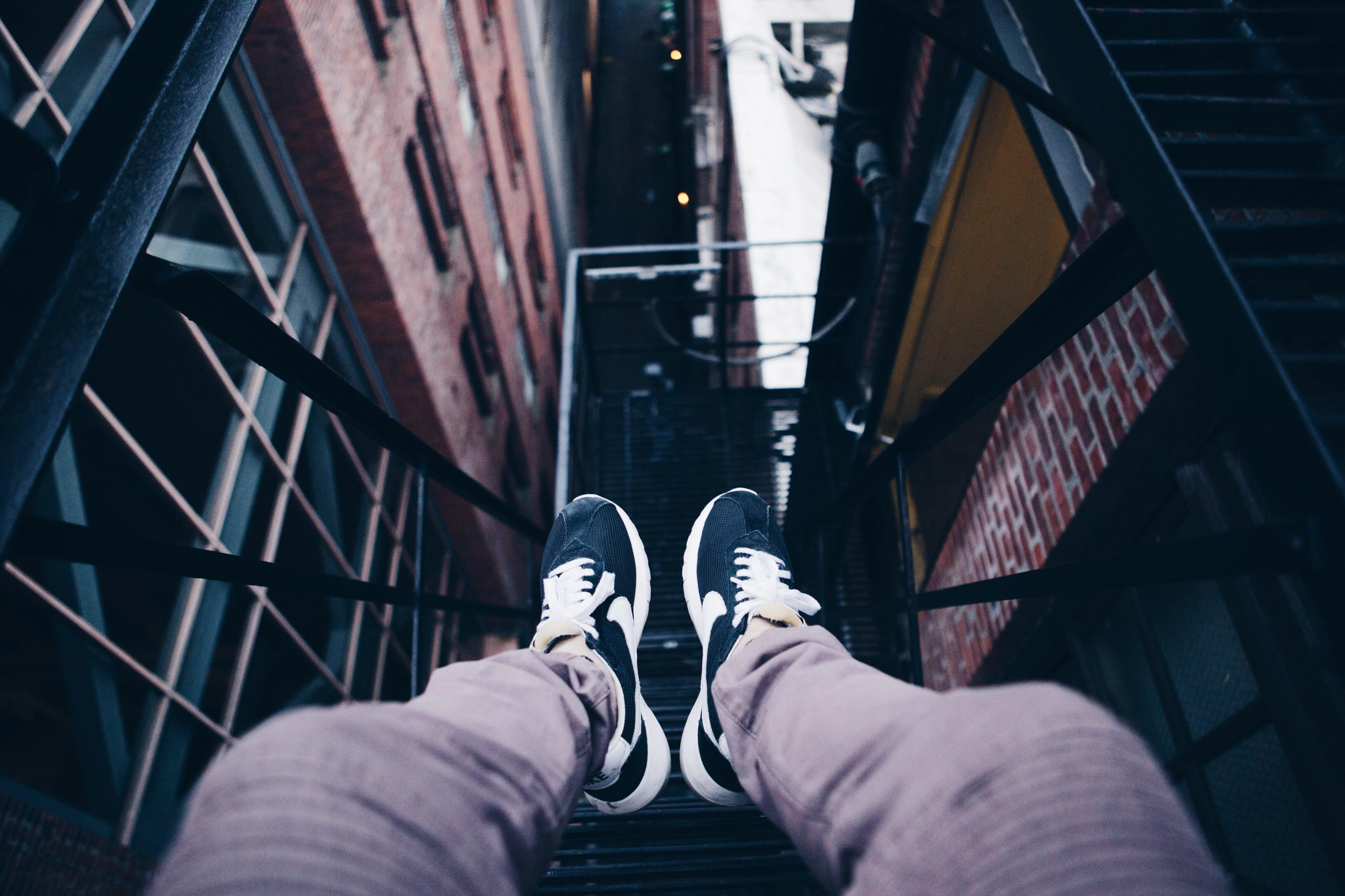 unrecognizable person, human, pair, brick, limb, city, one person, human leg, day, legs, lifestyles, shoes, personal perspective, building, building exterior, HD Wallpaper