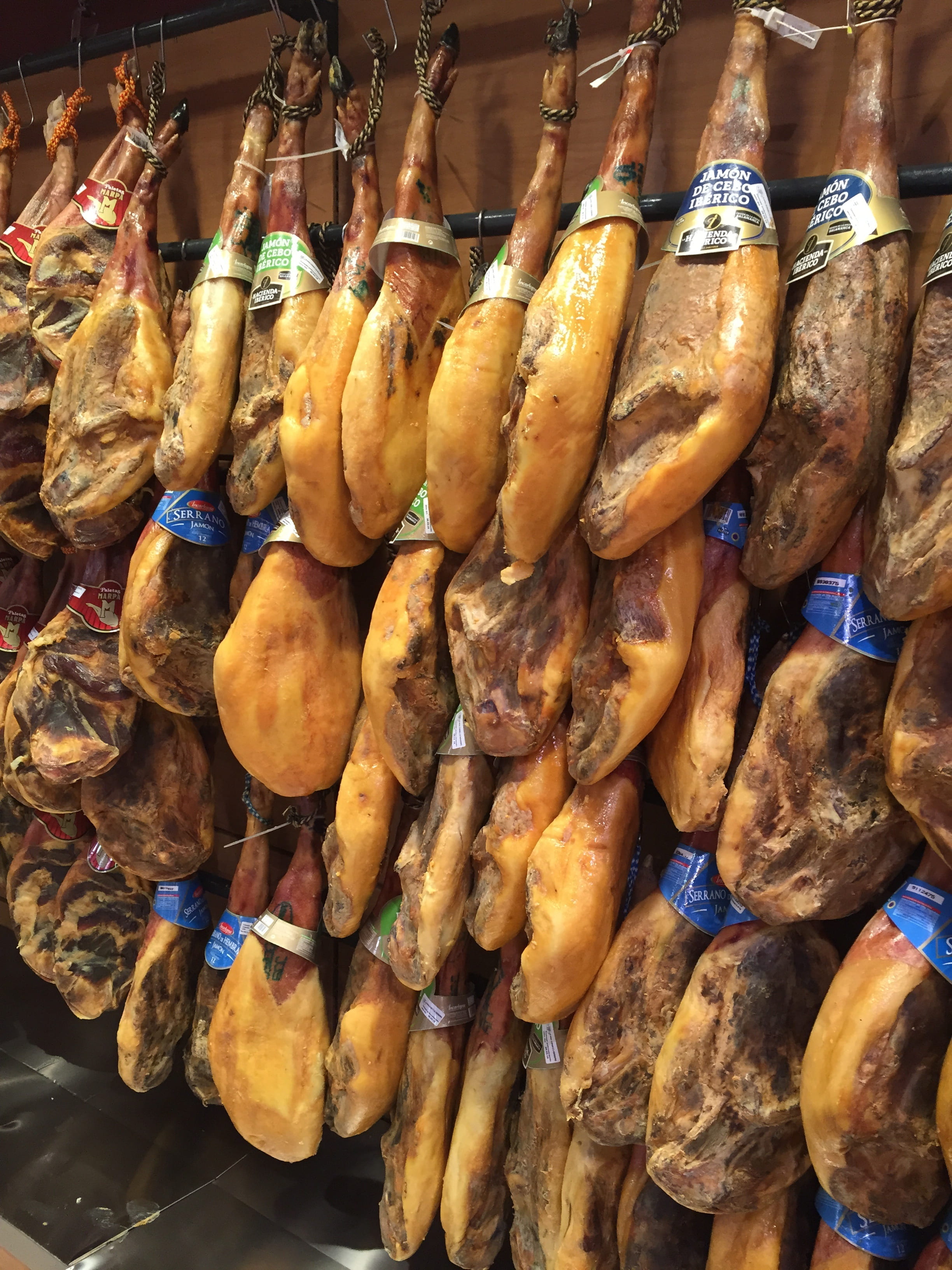 hams, food, hangs, business, brown, freshness, retail, spain, wall, food and drink, market, choice, for sale, hanging, legs, abundance, tapas, market stall, Phone HD Wallpaper