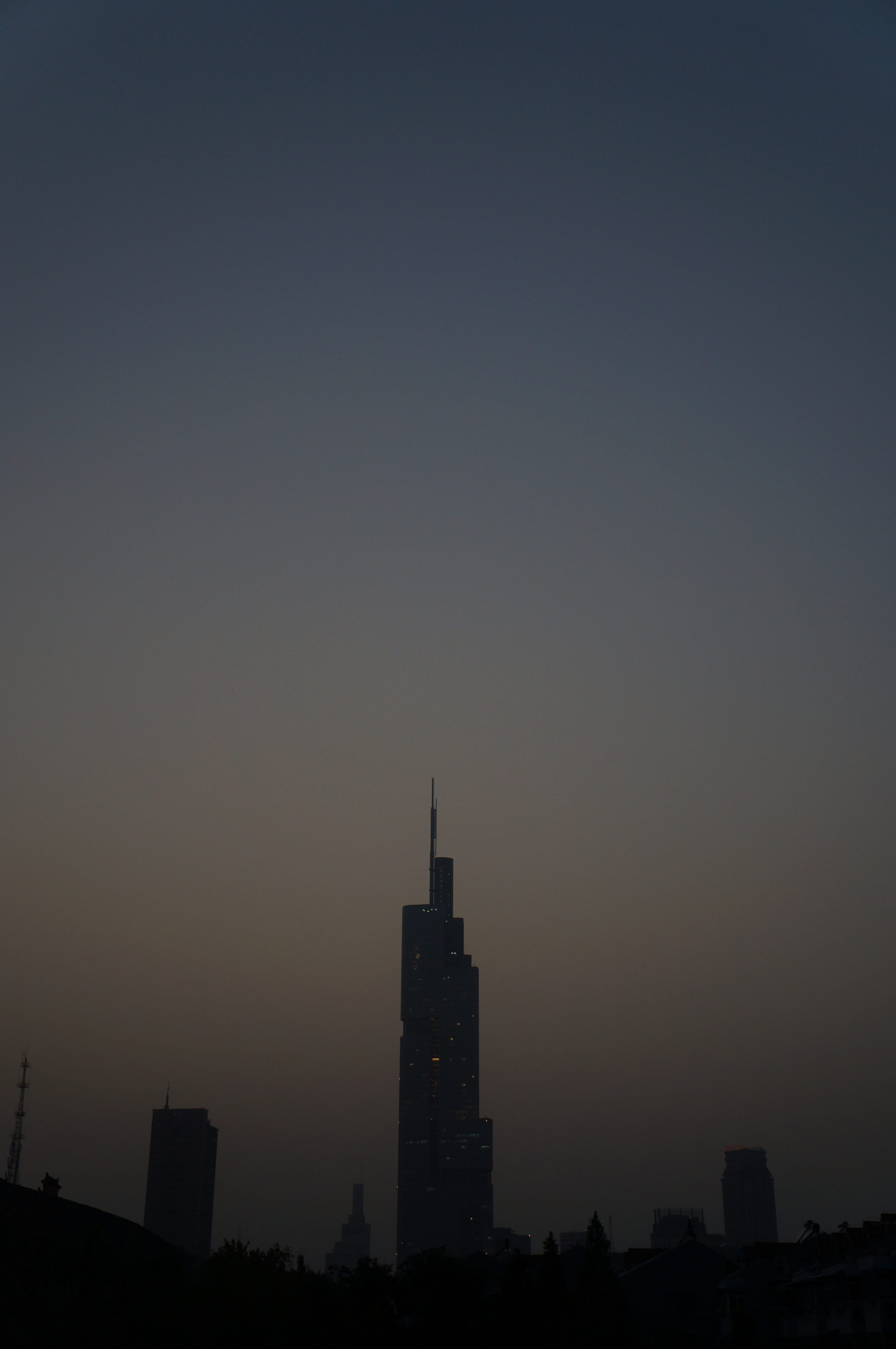 cityscape, silhouette, sky, sunset, outdoors, urban Skyline, no people, skyscraper, architecture, spire, building Exterior, financial district, Tall Buildings, Phone HD Wallpaper