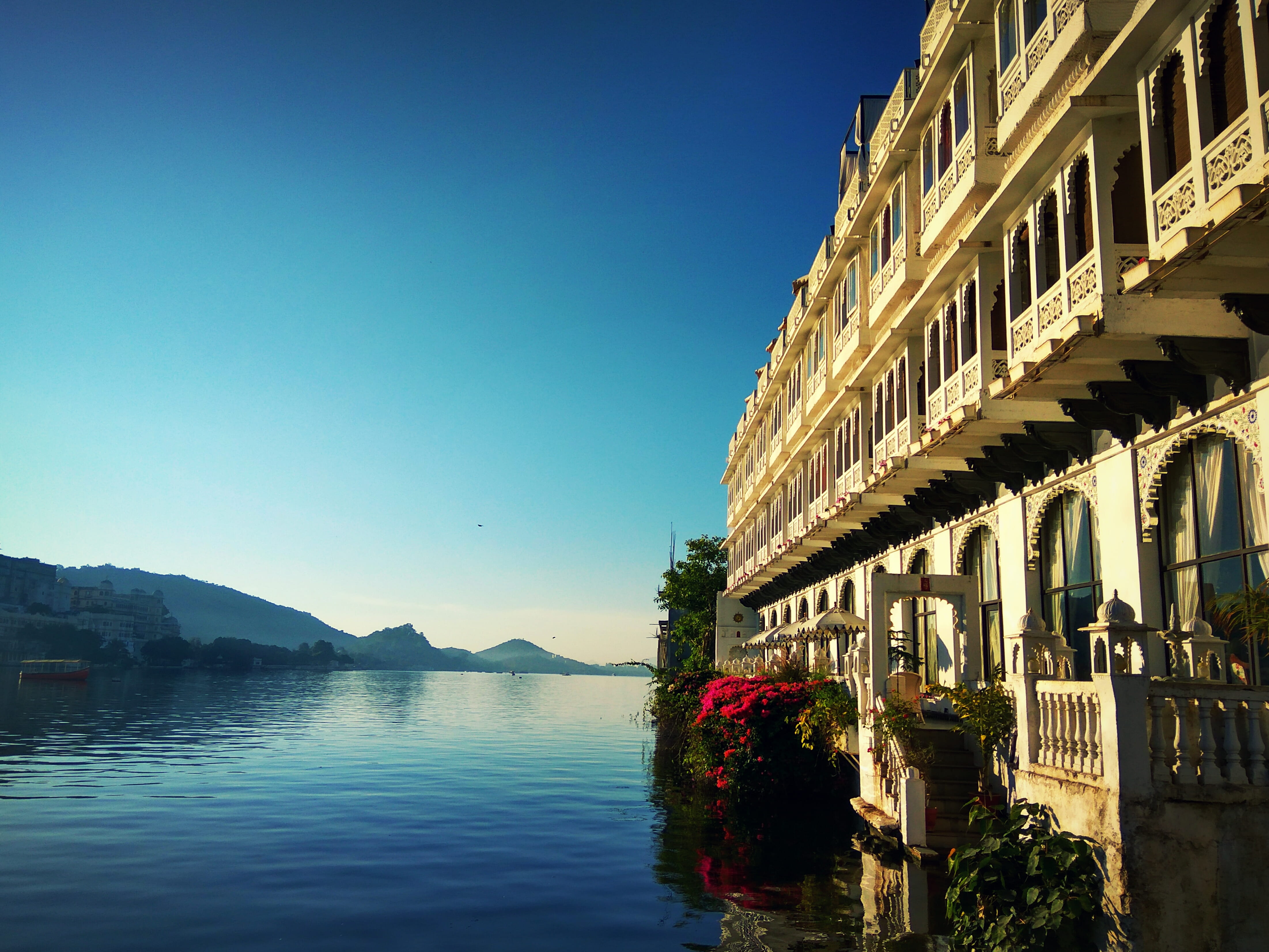 water, nature, beside, infrastructure, hotel, architecture, blue, built structure, no people, lakeside, apartment, day, body, waterfront, mountain, reflection, HD Wallpaper