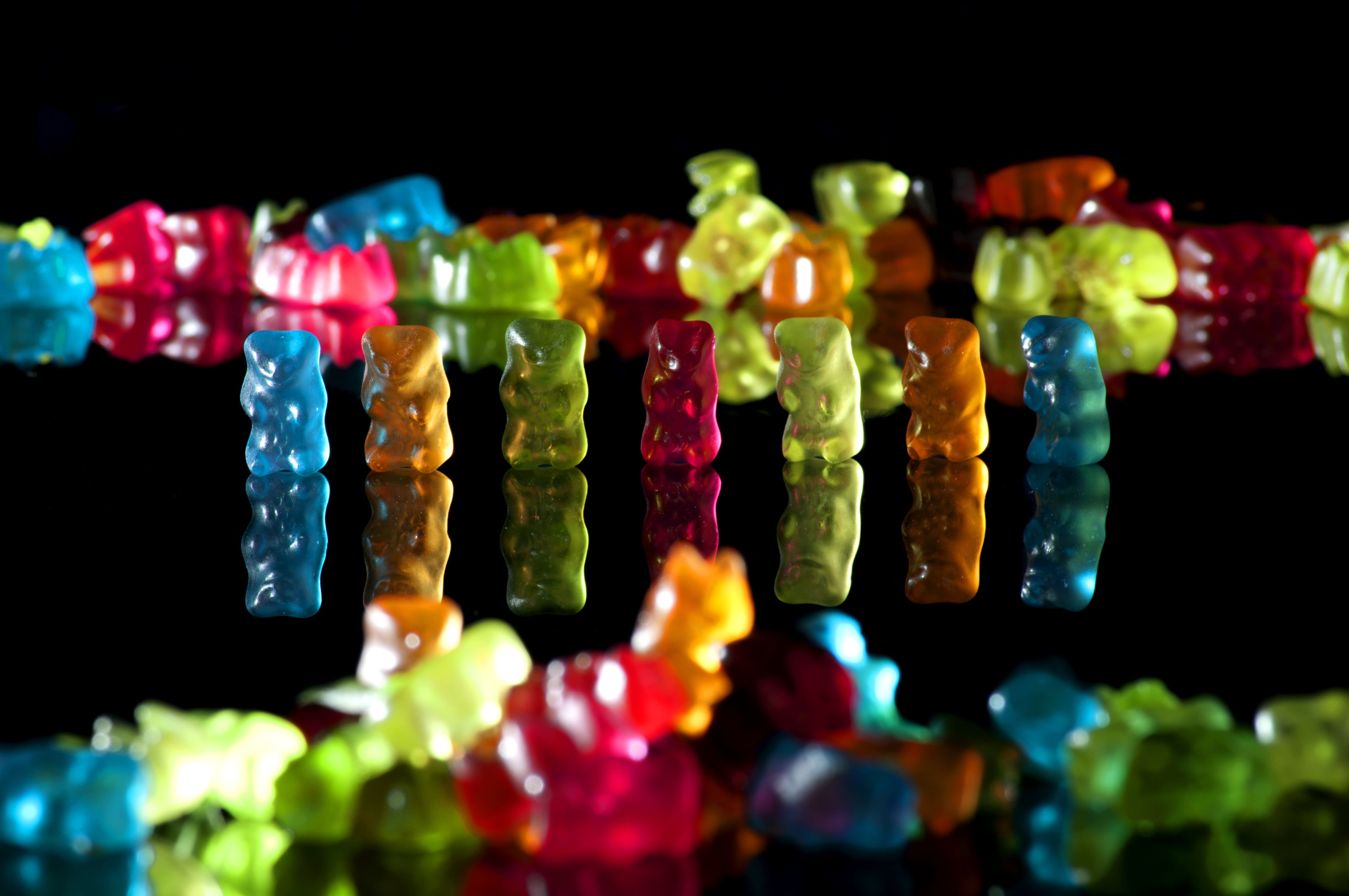 4K, indoors, indulgence, sweet food, gummi bears, selective focus, large group of objects, multi colored, abundance, black background, variation, close-up, HD Wallpaper