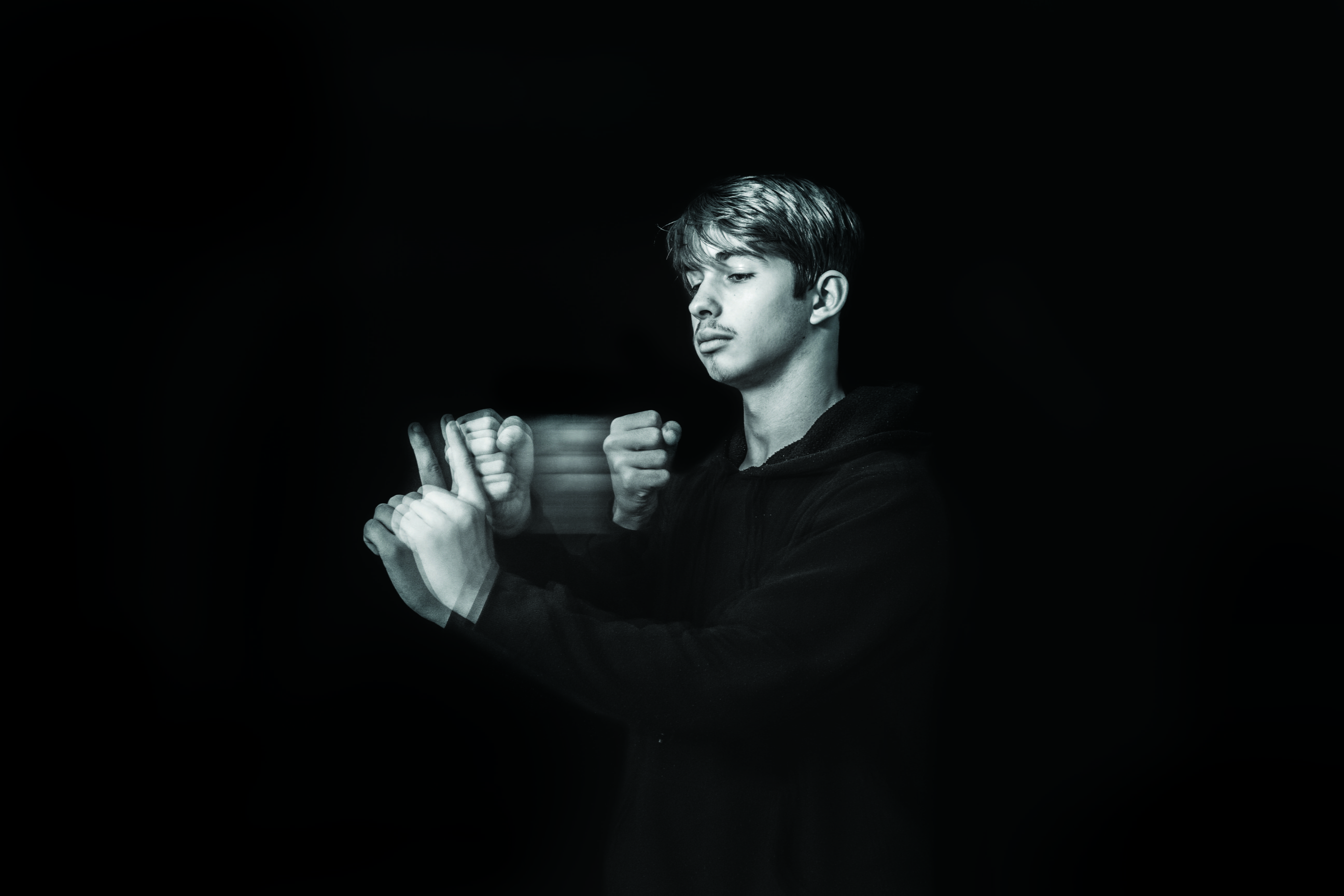 black color, holding, person, hand, long sleeve, sport, contemplation, portrait, man, people, dark, pullover, studio shot, communication, men, jaw, thumbs up, HD Wallpaper