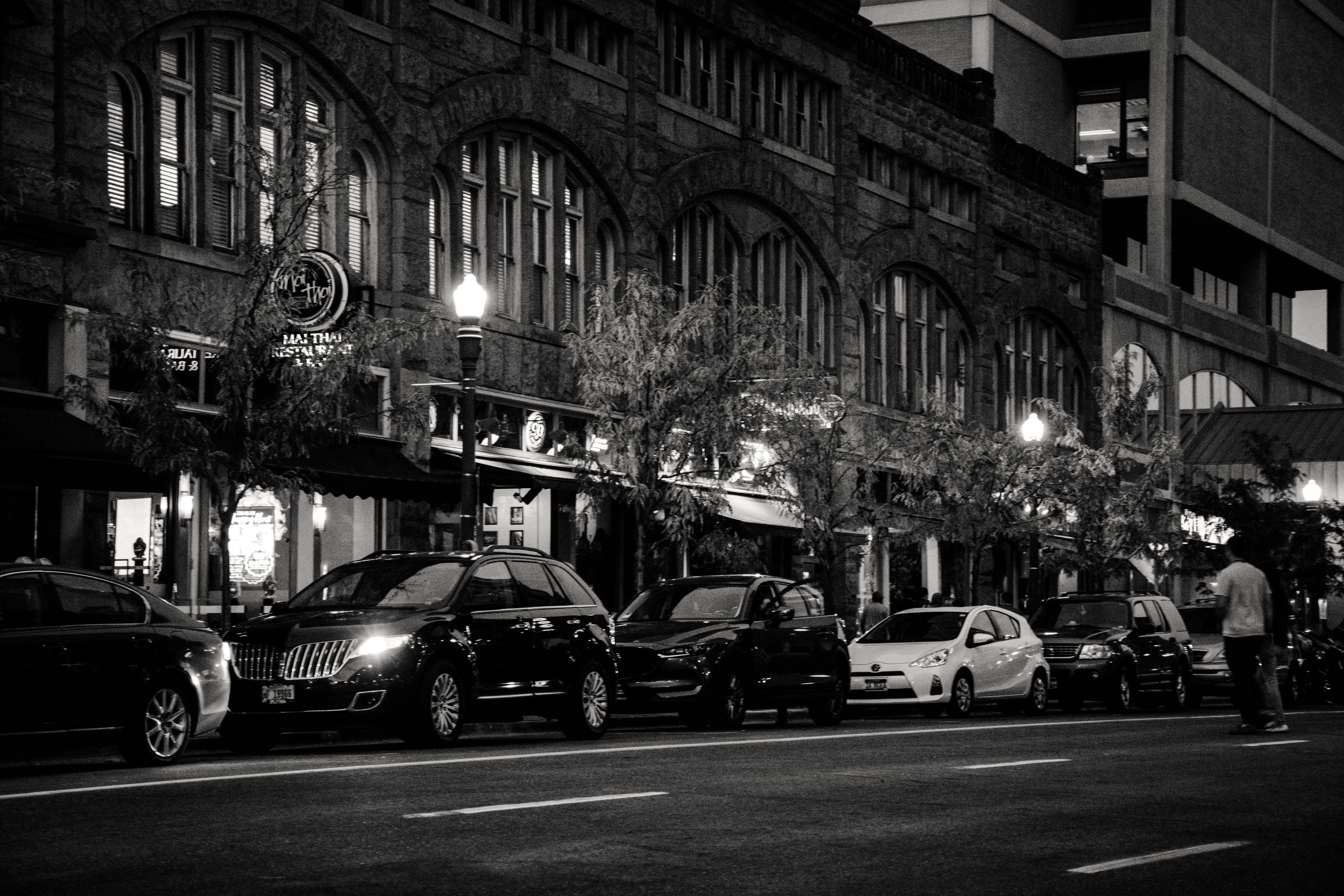 night, travel, 5K, grayscale, mode of transportation, people, pavement, street light, cars, no people, parked, architecture, land vehicle, motion, illuminated, HD Wallpaper