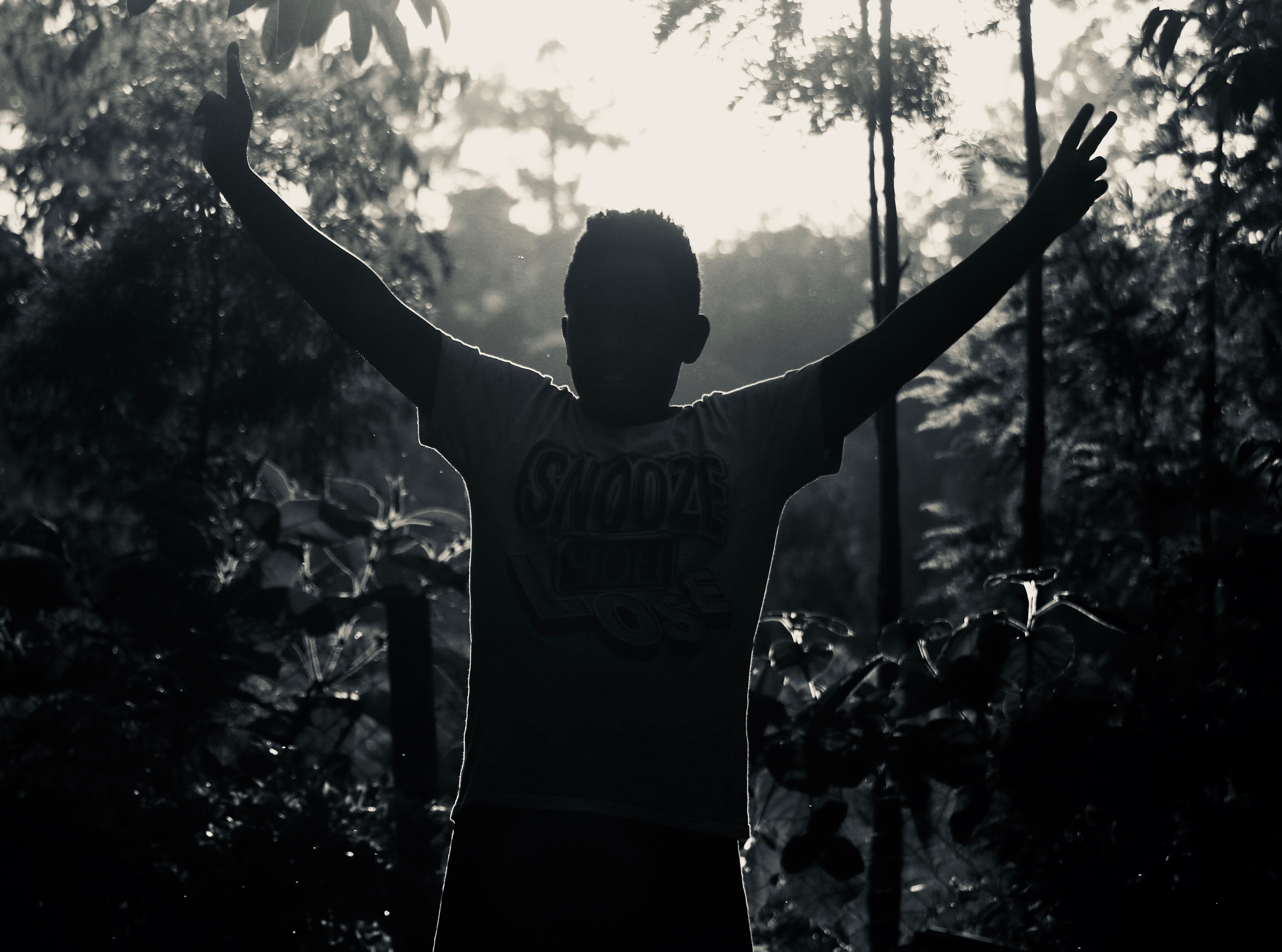 photo, wear, tree, nature, dark, black-and-white, outdoors, leisure activity, plant, light, one person, man, 4K, boy, three quarter length, raising, human arm, HD Wallpaper