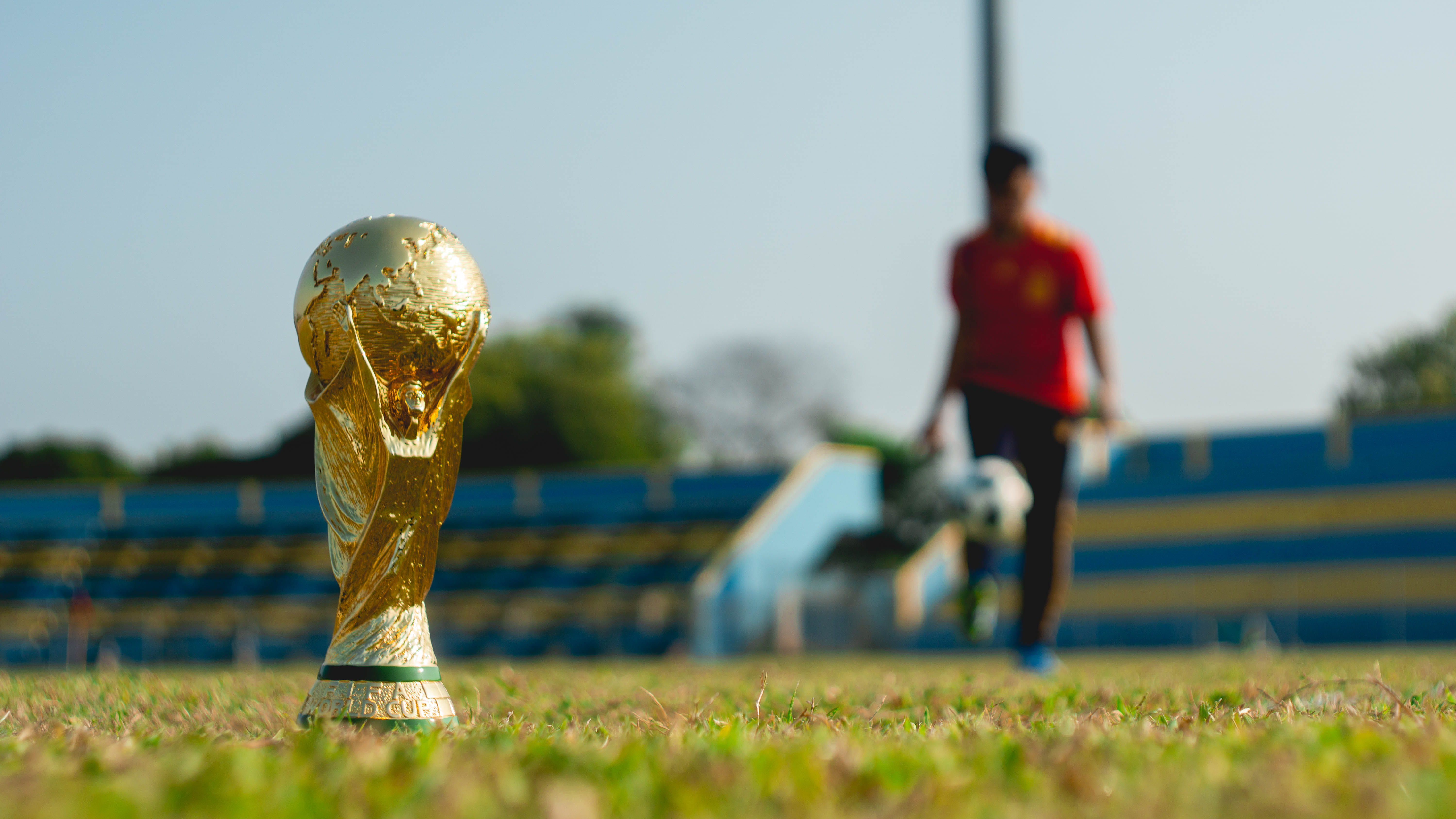 human, gold, incidental people, photography, malaysia, world cup, sunlight, playing field, men, competition, sport, selective focus, team sport, statue, HD Wallpaper