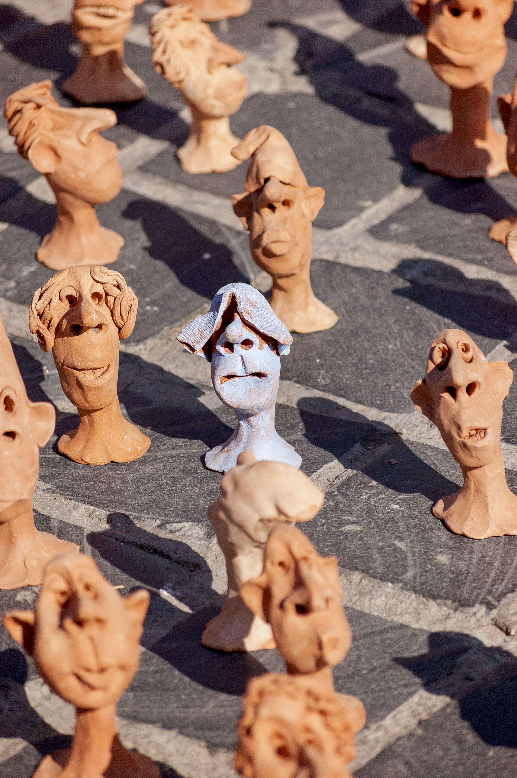 human limb, human, people, men, shadow, statue, day, figurine, pottery, head, high angle view, creative, cookie, sunlight, 2K, romania, city, outdoors, Phone HD Wallpaper