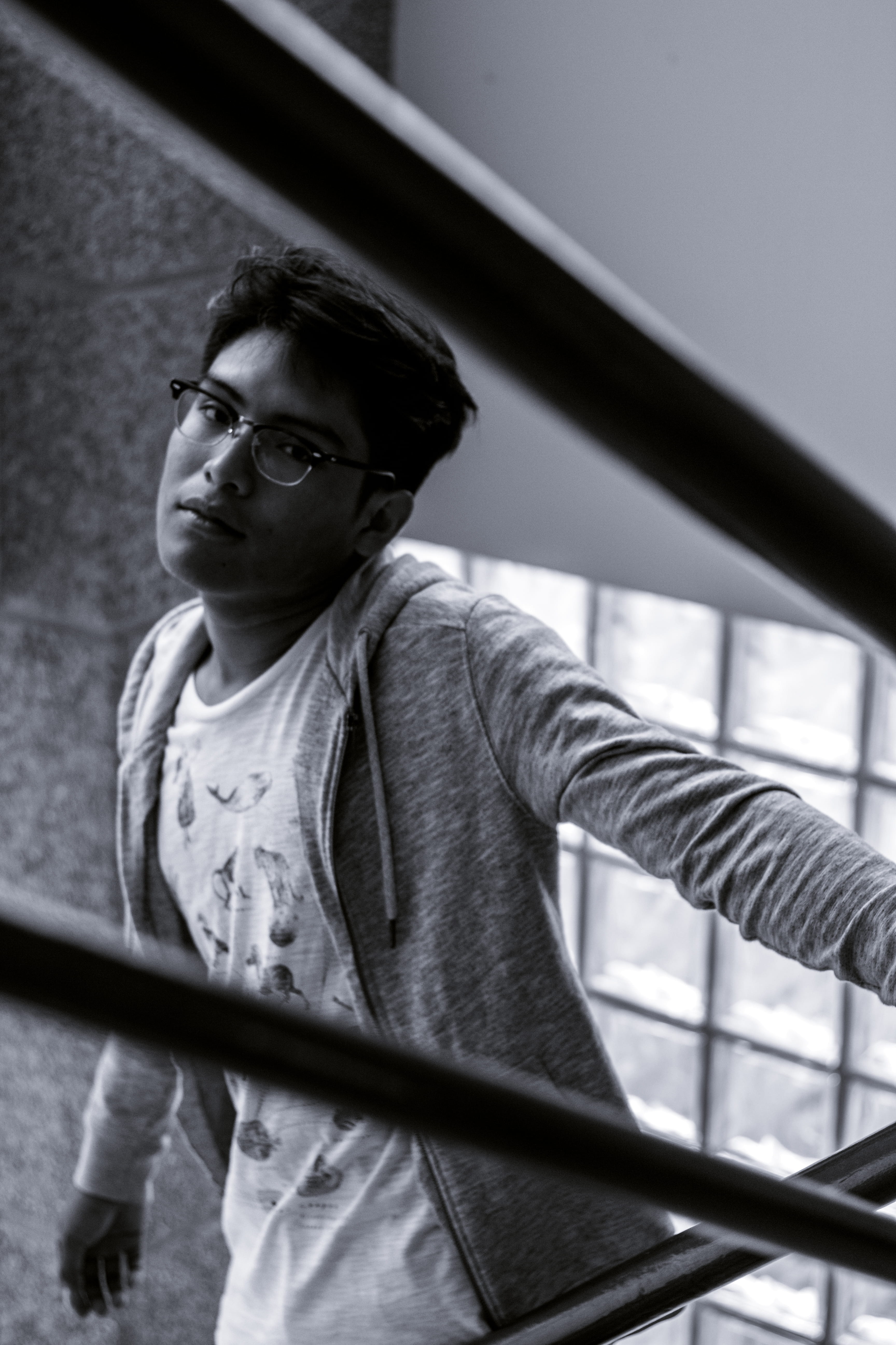 indoors, casual clothing, standing, lifestyles, men, looking away, contemplation, young adult, day, one person, bandw, glasses, front view, shadows, portrait, Phone HD Wallpaper