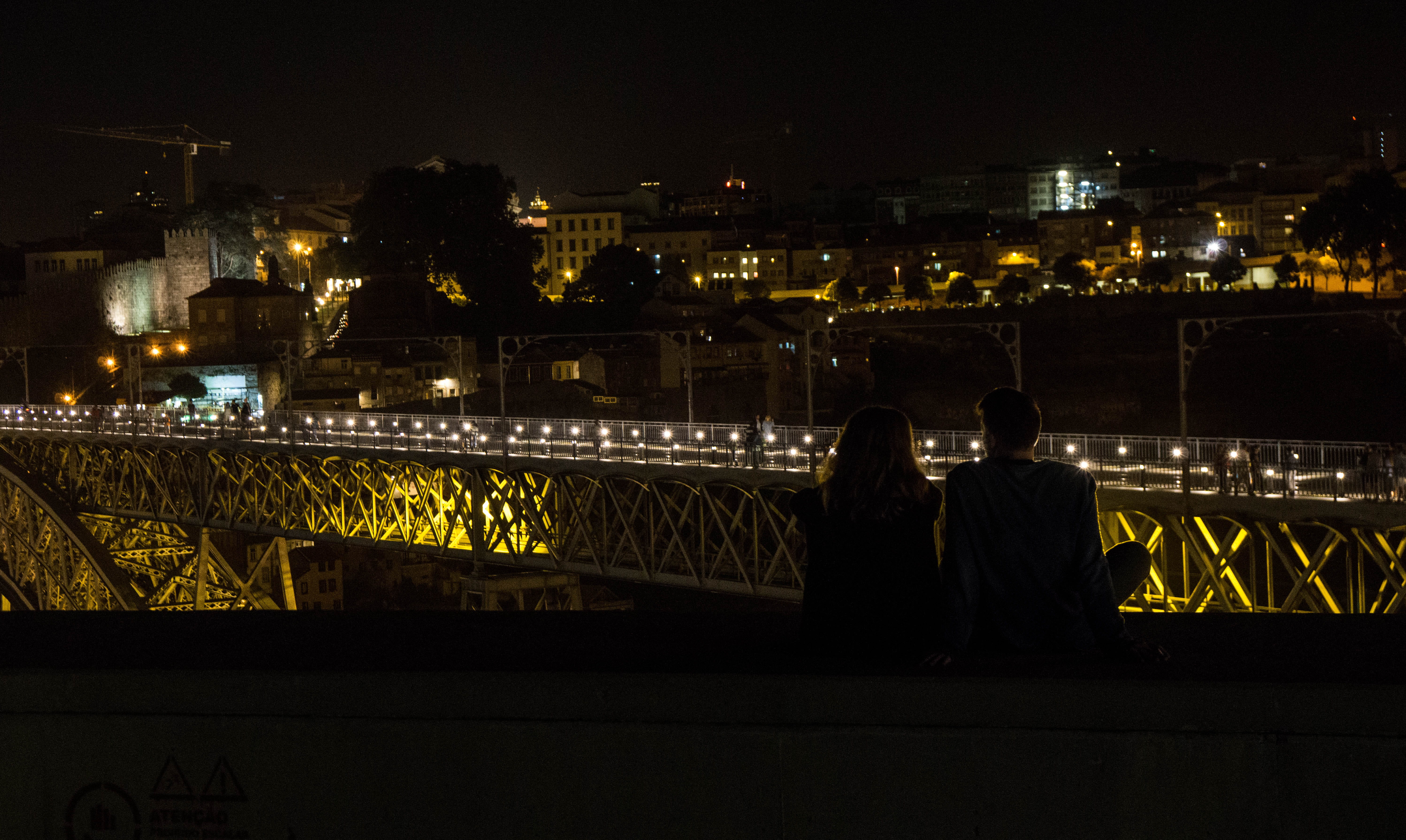 lovers, city, cityscape, sitting, bridge, love, outdoors, two people, built structure, rear view, real people, couple - relationship, couple, light, adult, HD Wallpaper