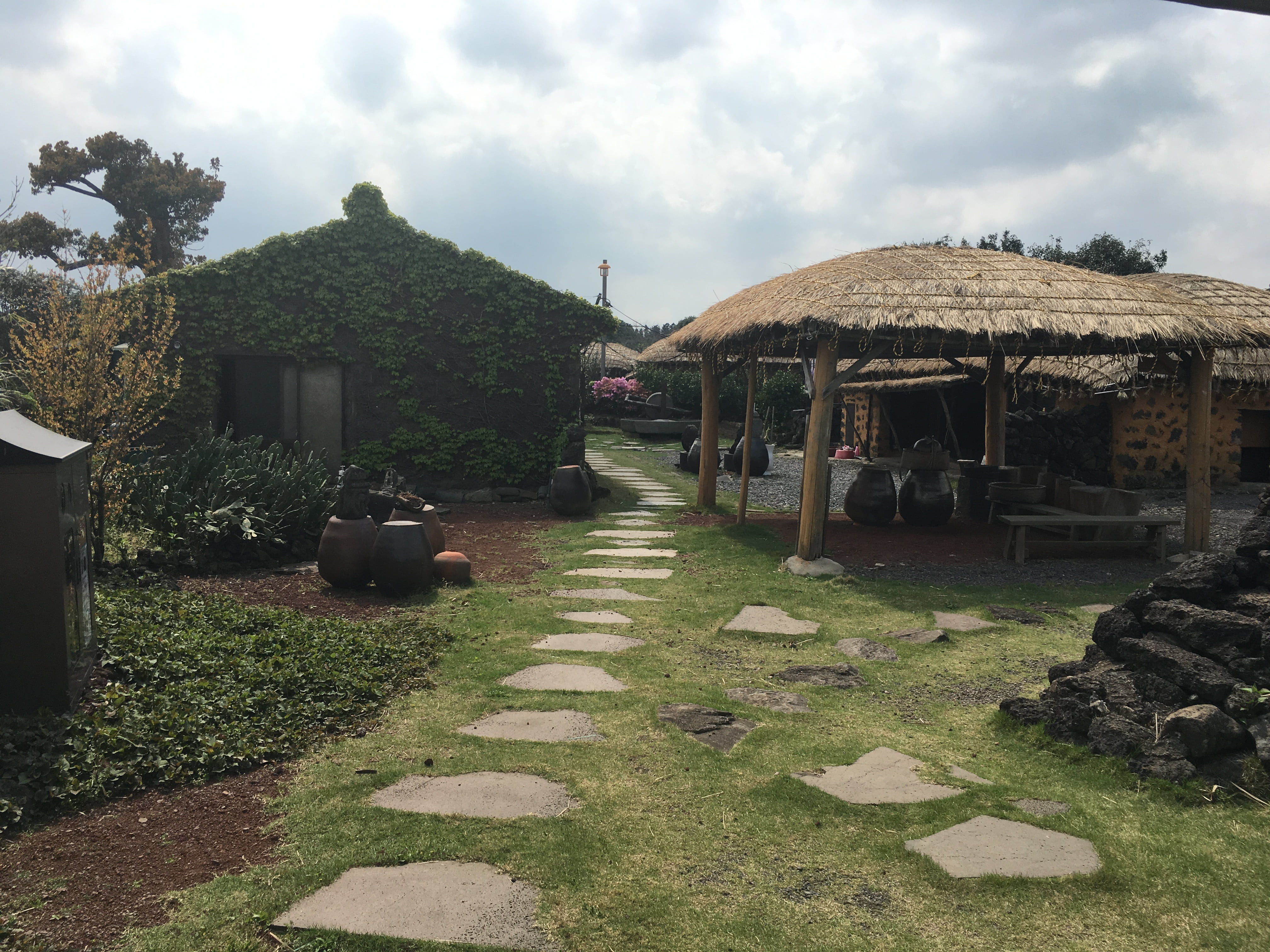 footpath, architecture, direction, cloud - sky, the way forward, religion, stone, plant, solid, grass, jeju island, traditional houses, building exterior, HD Wallpaper