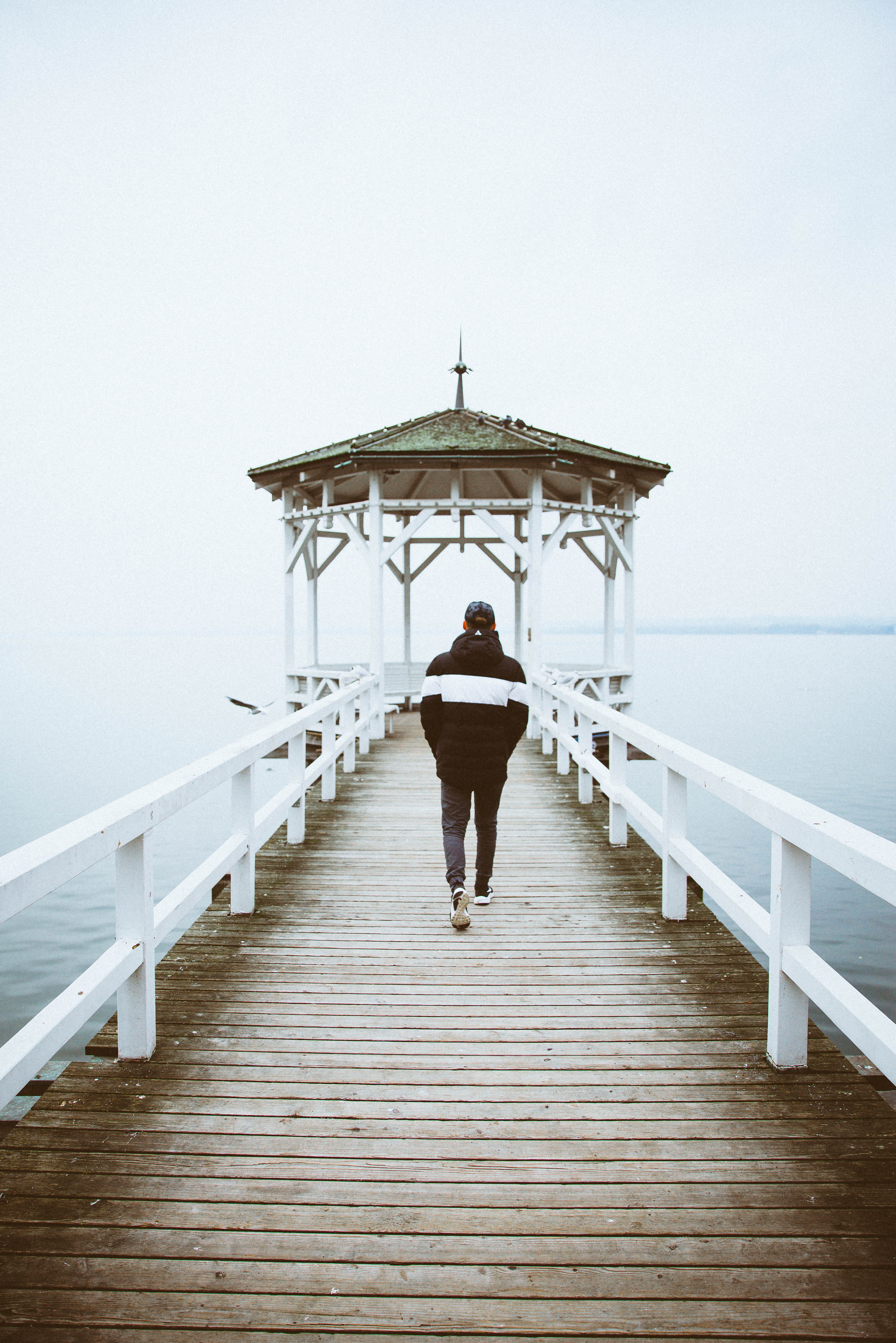 outdoors, sea, hat, bridge, wooden, lake constance, water, architecture, clear sky, real people, friend, wood - material, lifestyles, wood, pier, 5K, towards, Phone HD Wallpaper