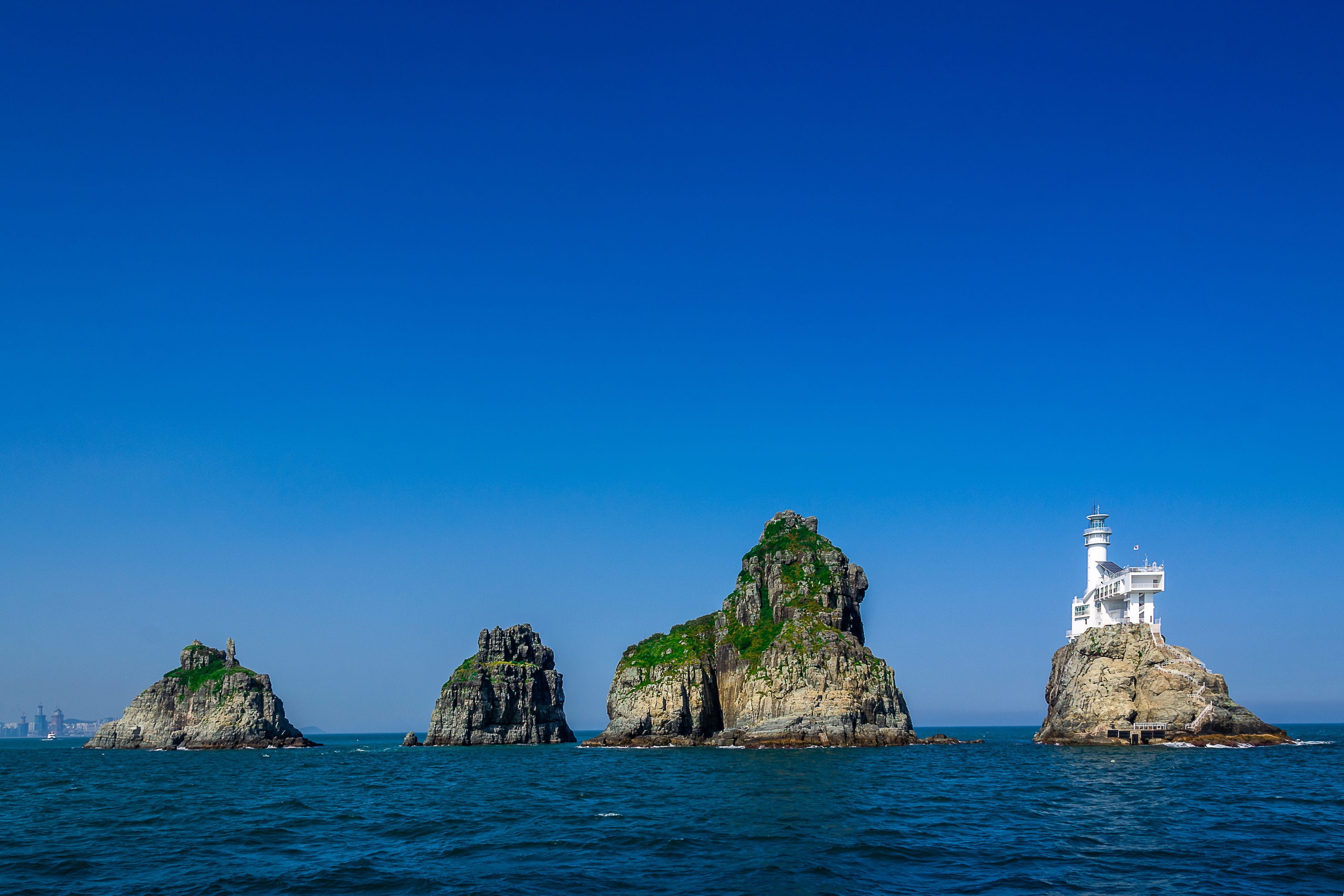 water, scenics - nature, island, solid, rock - object, haeundae beach, blue, rock formation, outdoors, clear sky, no people, stack rock, oryukdo, day, 4K, HD Wallpaper