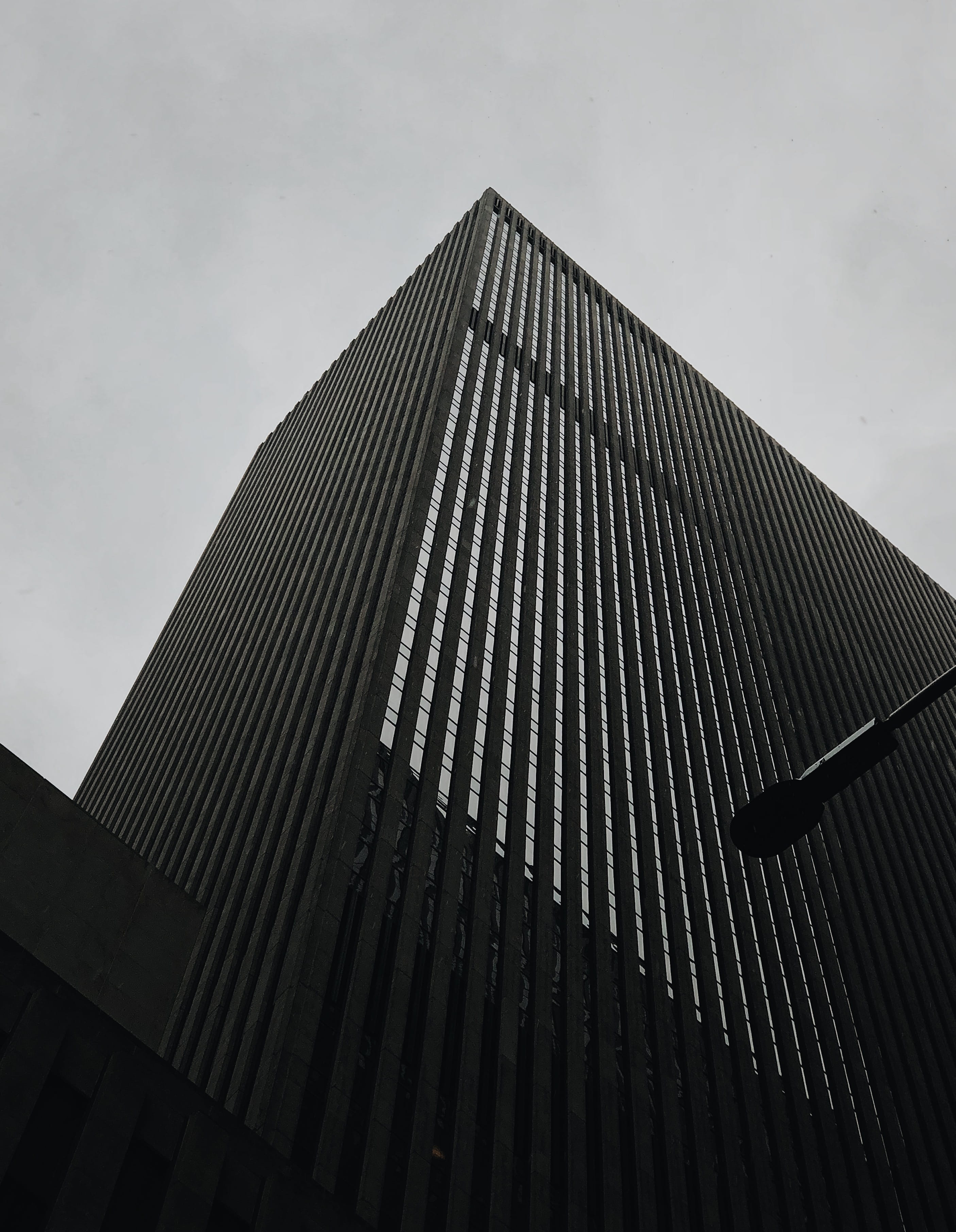 city, sky, built structure, low angle view, nyc, 2K, rainy, dusk, pattern, skyscraper, glass, 30 rock st, nature, no people, moody, building, concrete jungle, Phone HD Wallpaper
