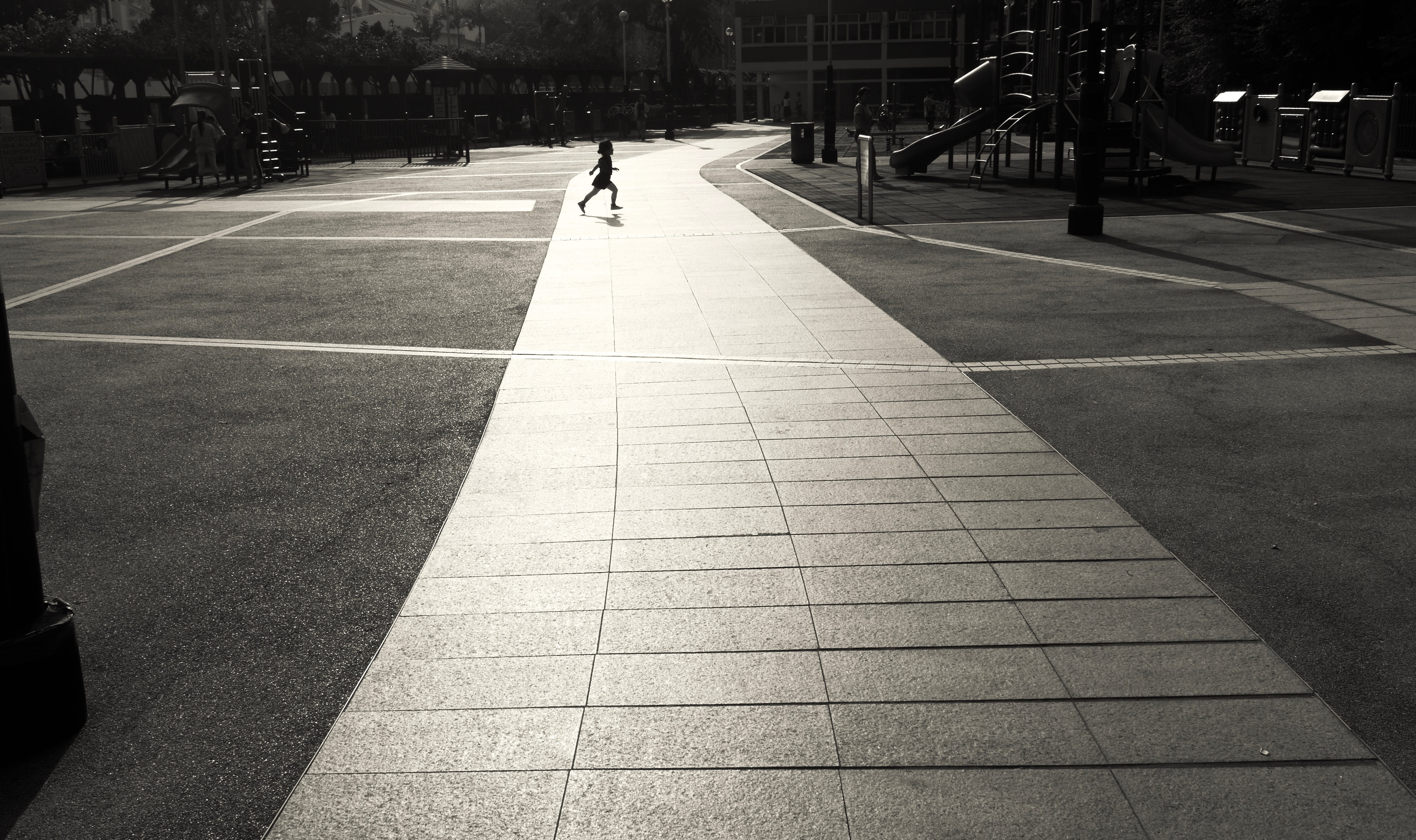 real people, citylife, direction, street, shadow, city, men, tiled floor, the way forward, architecture, b/w, playing, day, outdoors, sunlight, people, HD Wallpaper