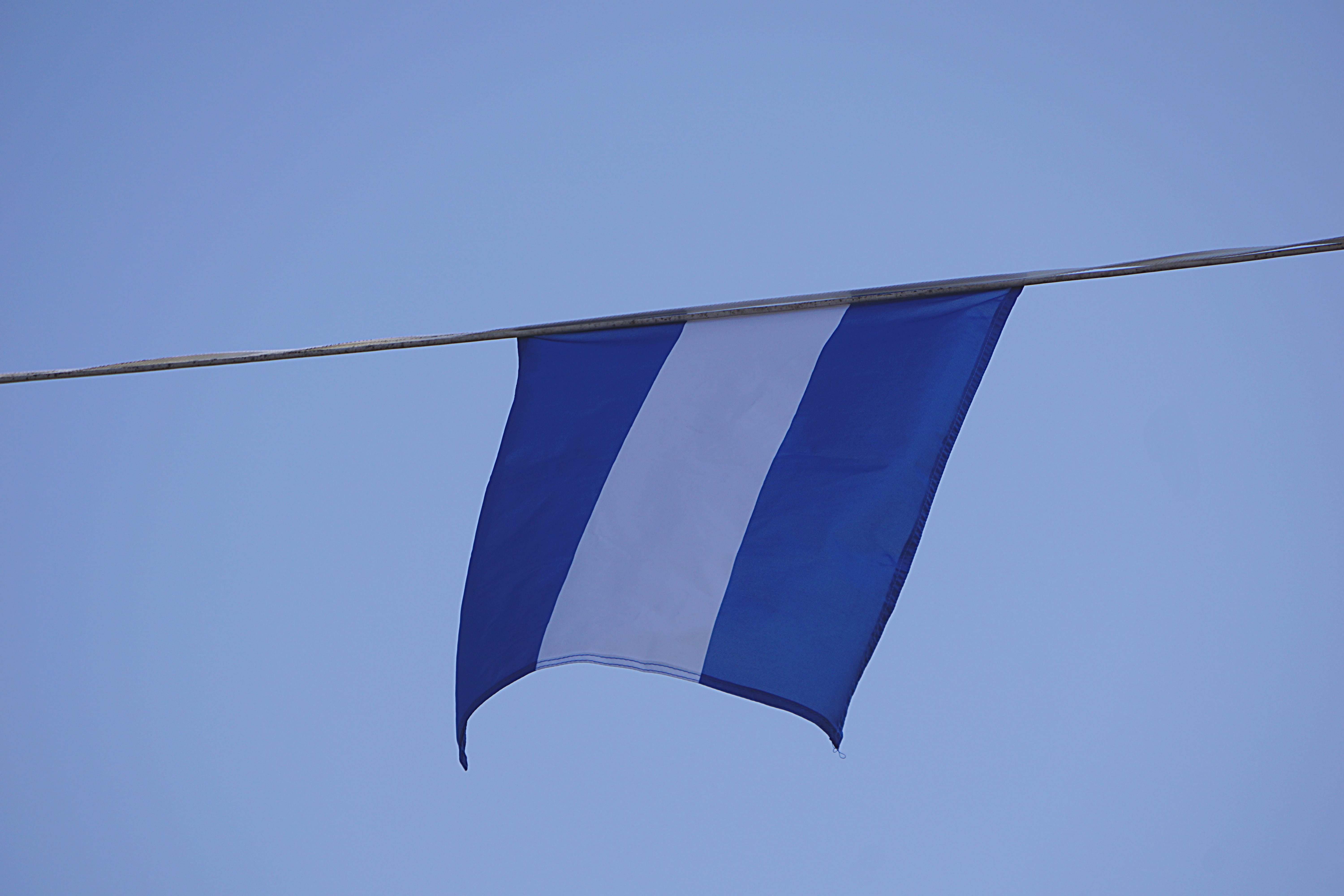 low angle view, white, freedom, stripe, flag, no people, flying, sky, day, outdoors, blue, transportation, hung, sunny, copy space, clear sky, nature, clean, HD Wallpaper