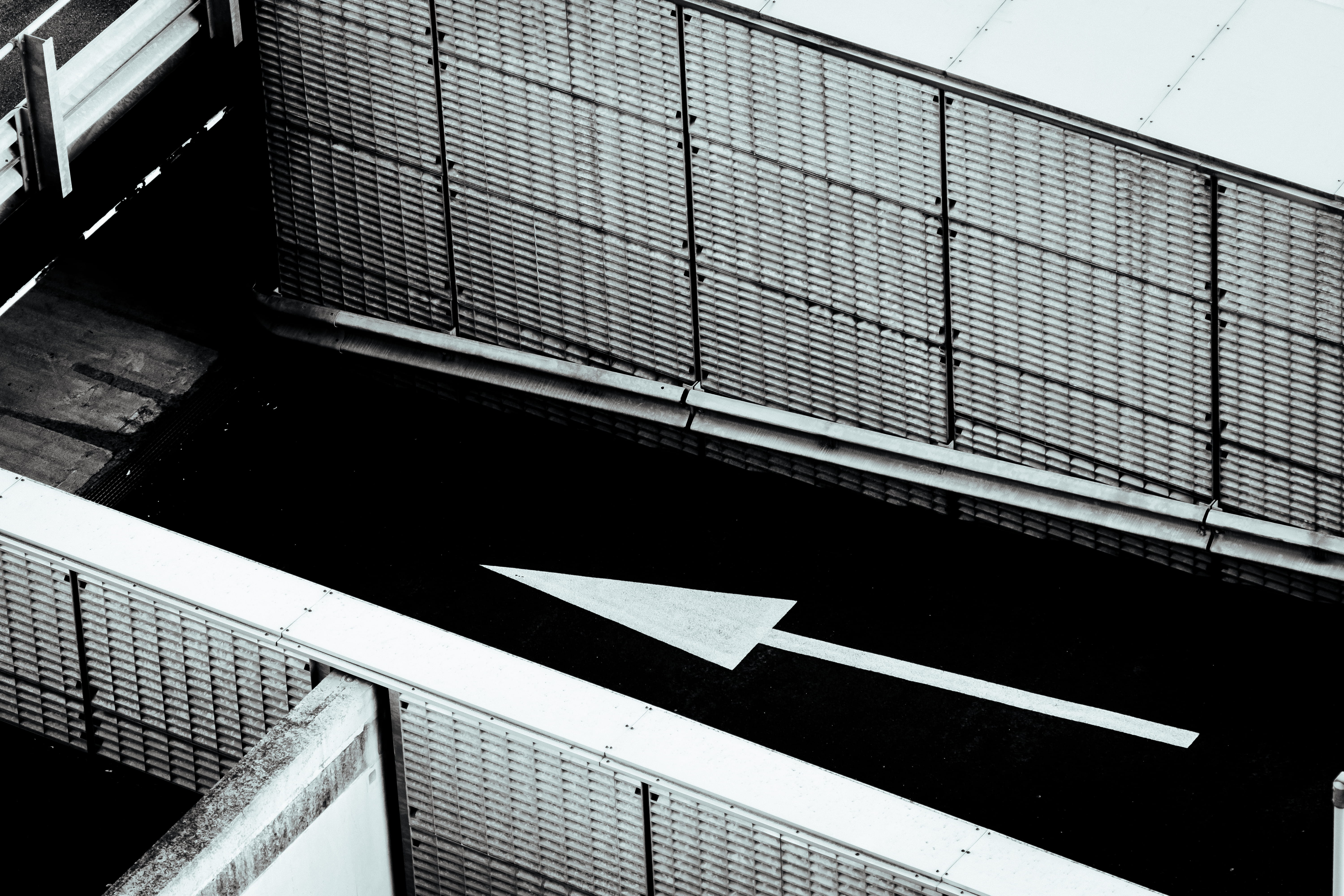 architecture, black and white, parking garage, nature, high angle view, sign, solar panels, day, building exterior, building, arrow, 5K, symbol, text, HD Wallpaper