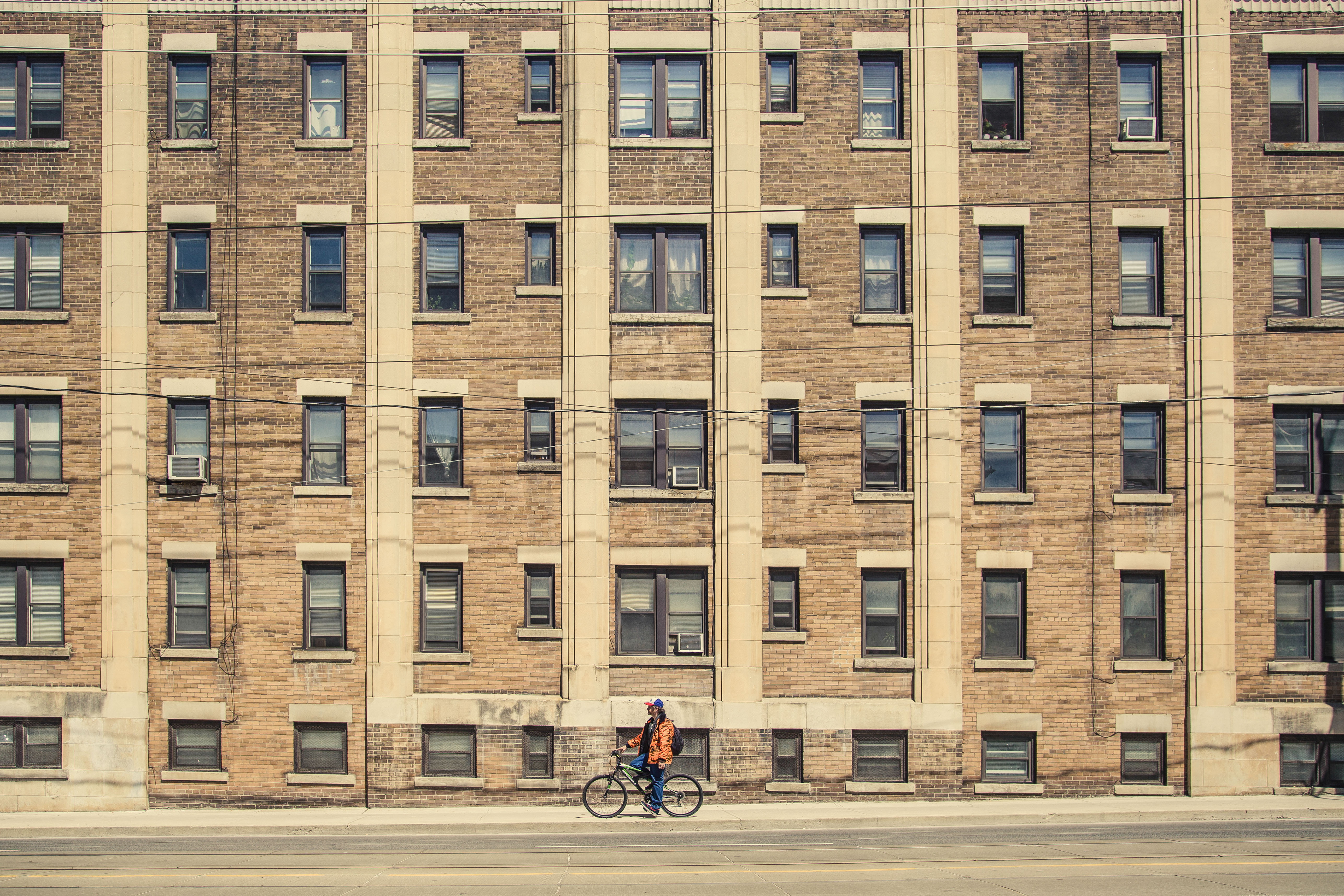 cycling, bike, outdoors, 5K, person, one person, ride, riding, near, road, built structure, building, window, city, bicycle, street, people, apartment, HD Wallpaper
