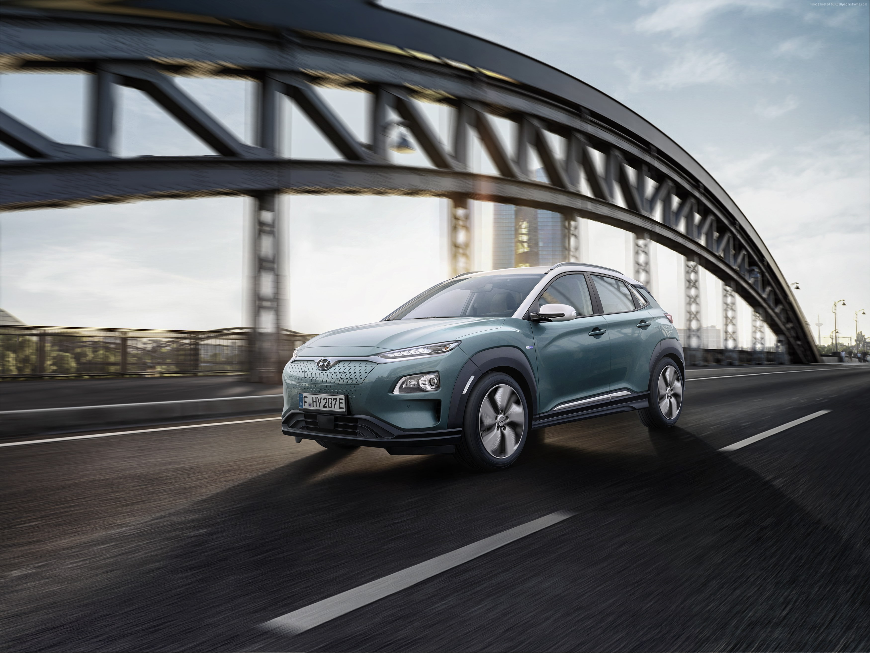 outdoors, Geneva Motor Show 2018, on the move, built structure, city, Hyundai Kona Electric, road, motion, architecture, day, motor vehicle, 4K, land vehicle, HD Wallpaper