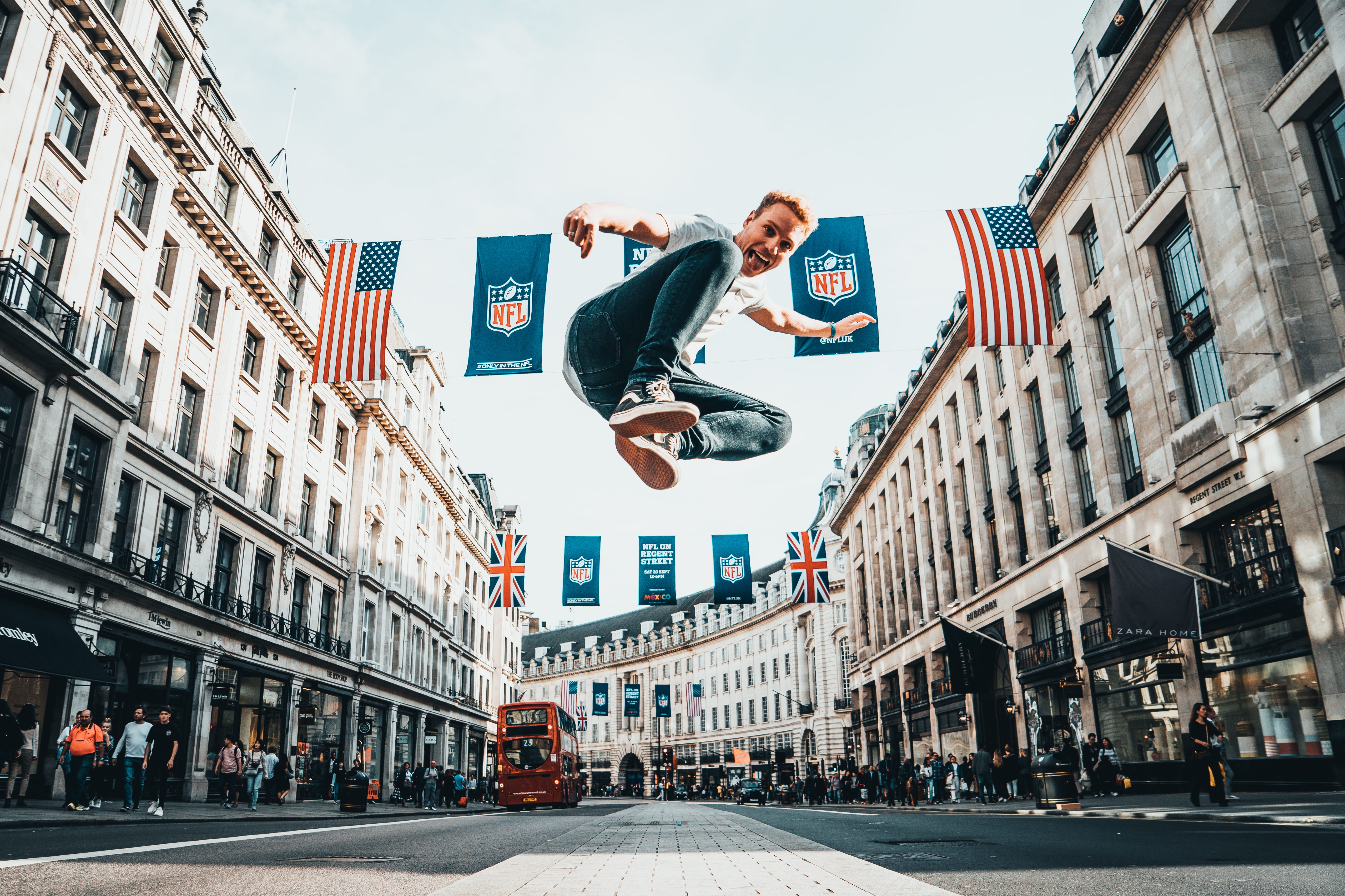 human arm, 5K, bunting, man, architecture, street, surface, streetscene, built structure, nfl, low angle view, cloudy, city life, concrete, one person, HD Wallpaper