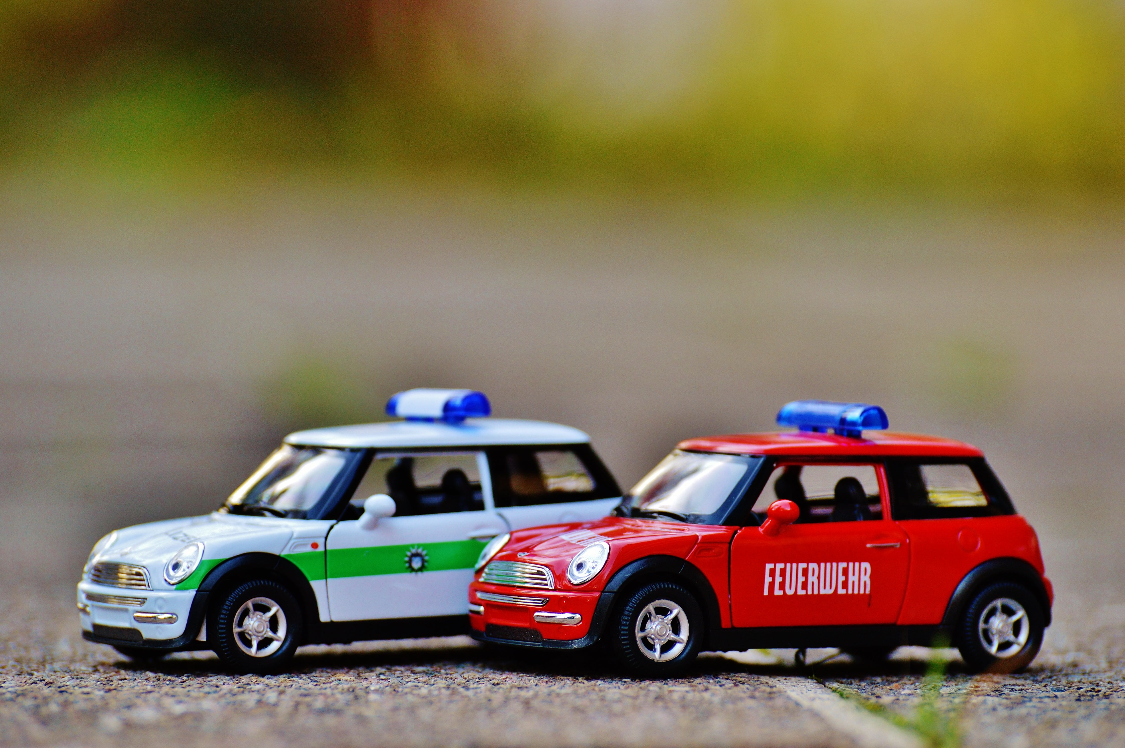 day, multi colored, shallow, red, competition, vehicles, auto, transportation, field, fire, fire truck, toys, sports race, cooper, blue light, copy space, HD Wallpaper