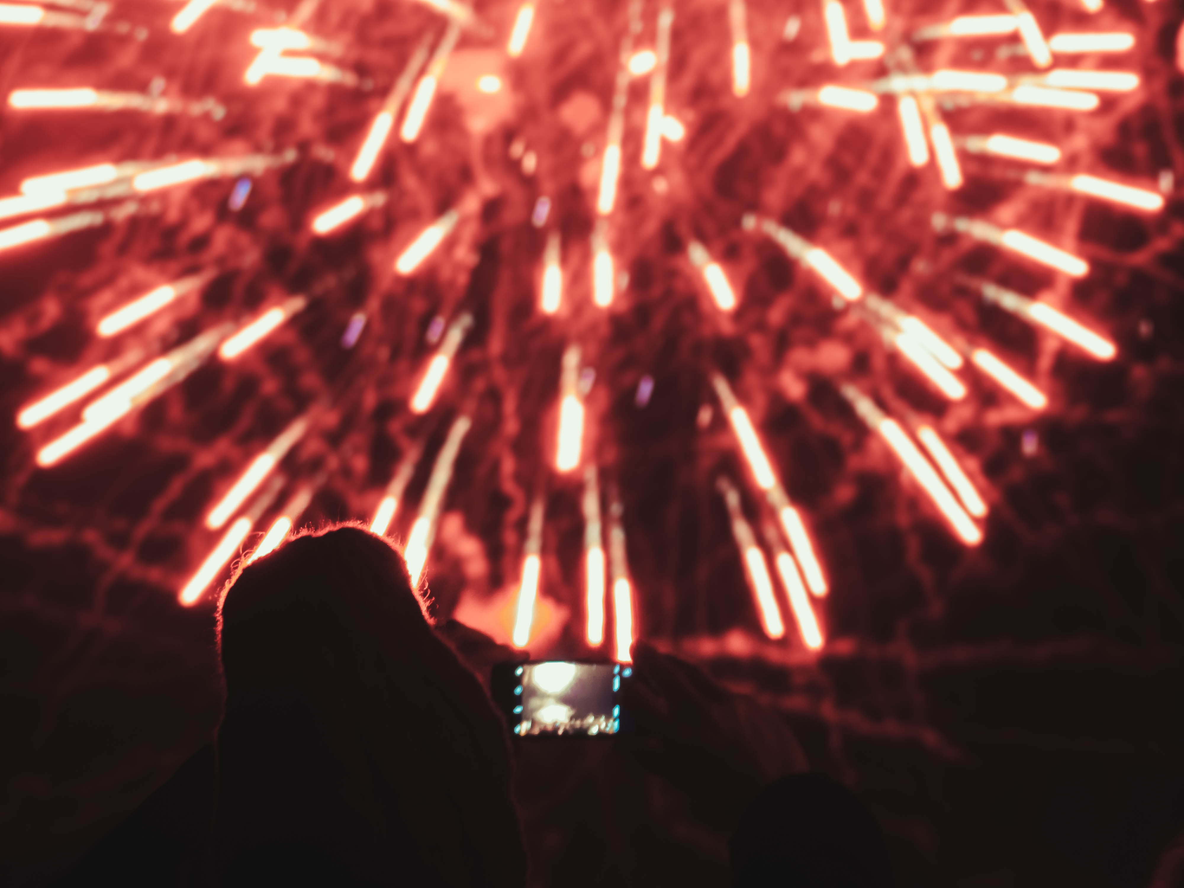 night, festive, phone, red, photo, sparks, motion, fireworks, arts culture and entertainment, leisure activity, adult, standing, 4K, firework display, HD Wallpaper
