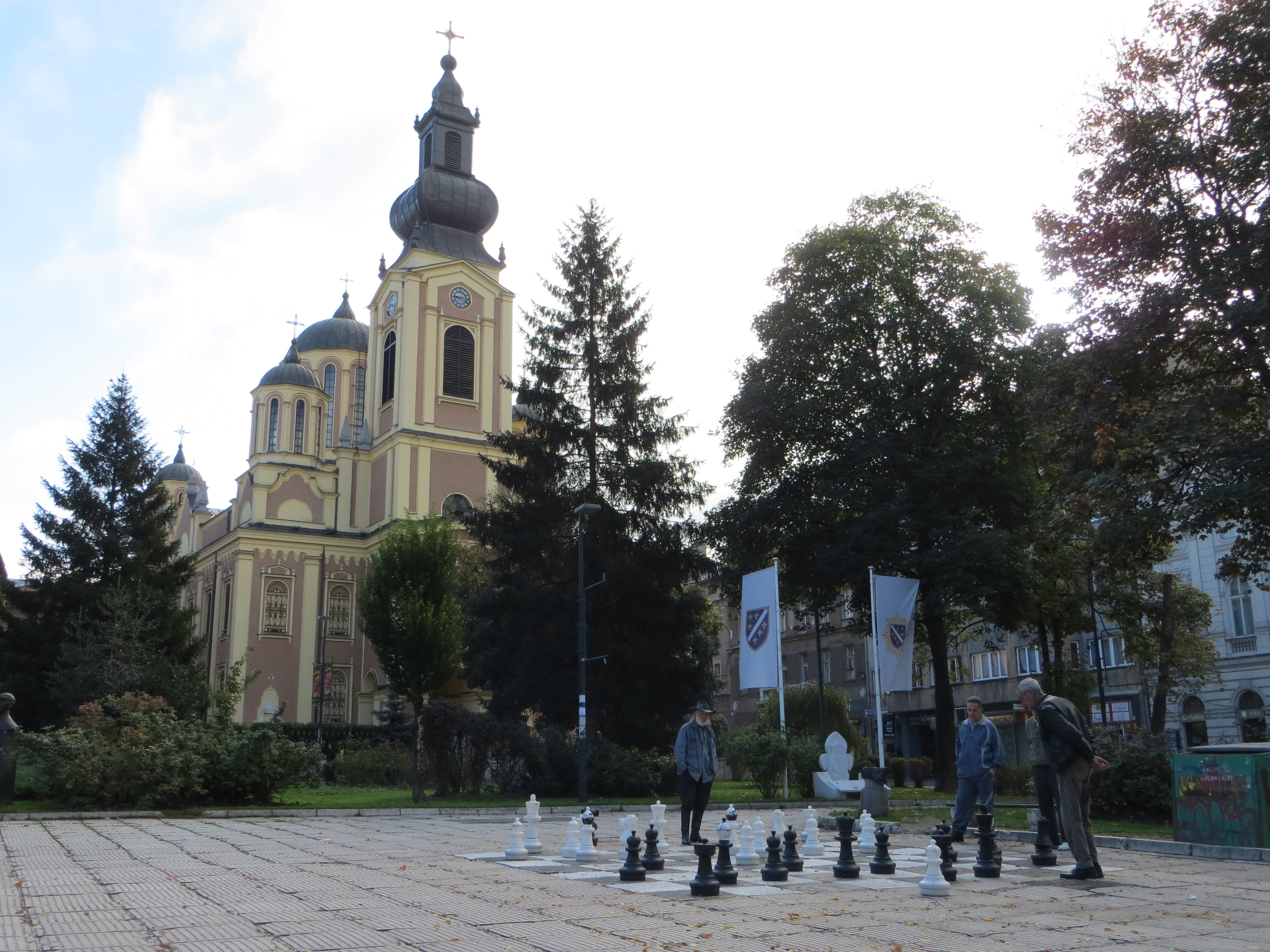 real people, spirituality, building, day, men, tree, group of people, place of worship, theotokos, church, built structure, sarajevo, sky, cathedral, nativity of the theotokos, HD Wallpaper