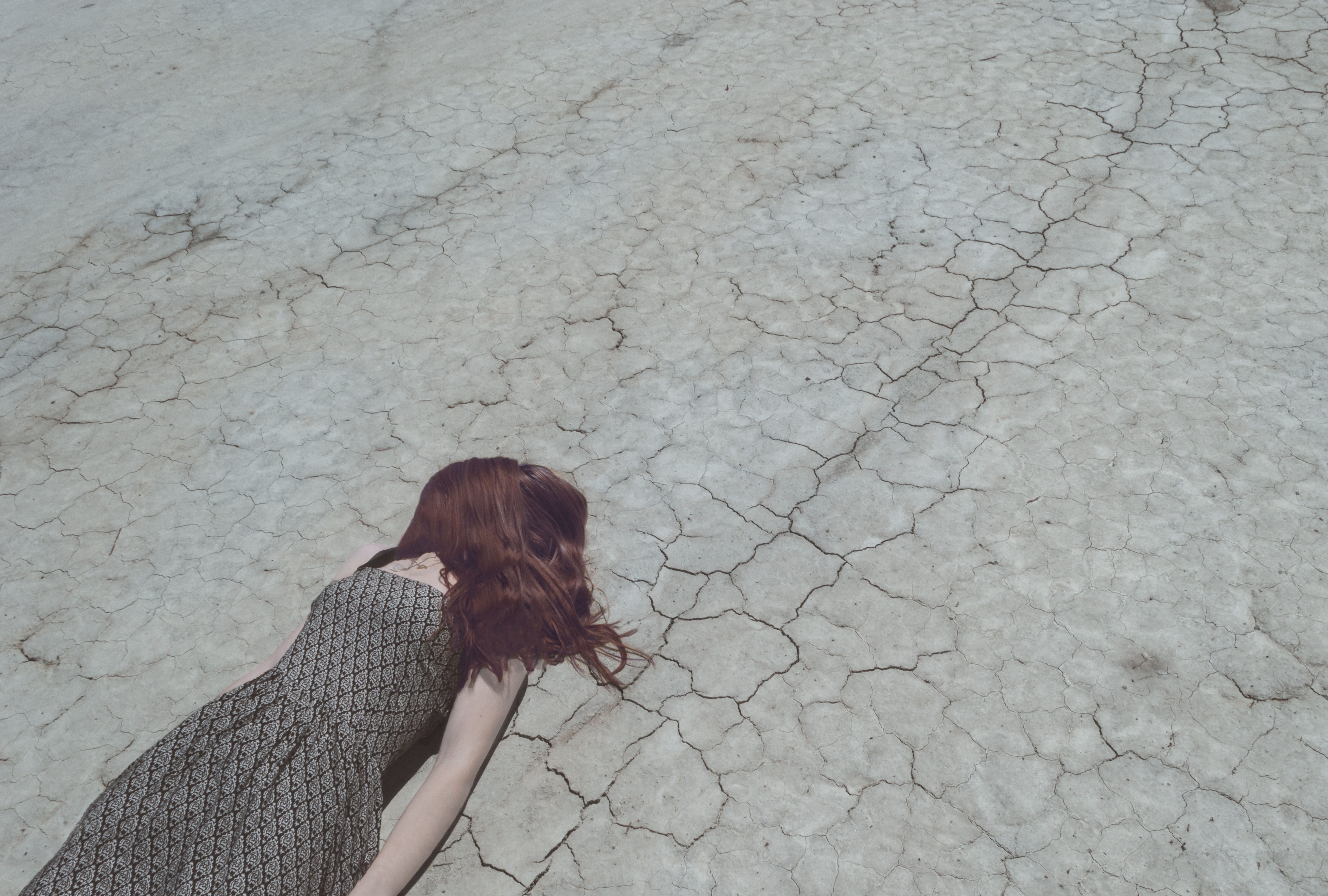 woman, hairstyle, gray, day, side view, crack, cracked, dress, lying, climate, leisure activity, ground, young adult, casual clothing, adult, depression, HD Wallpaper