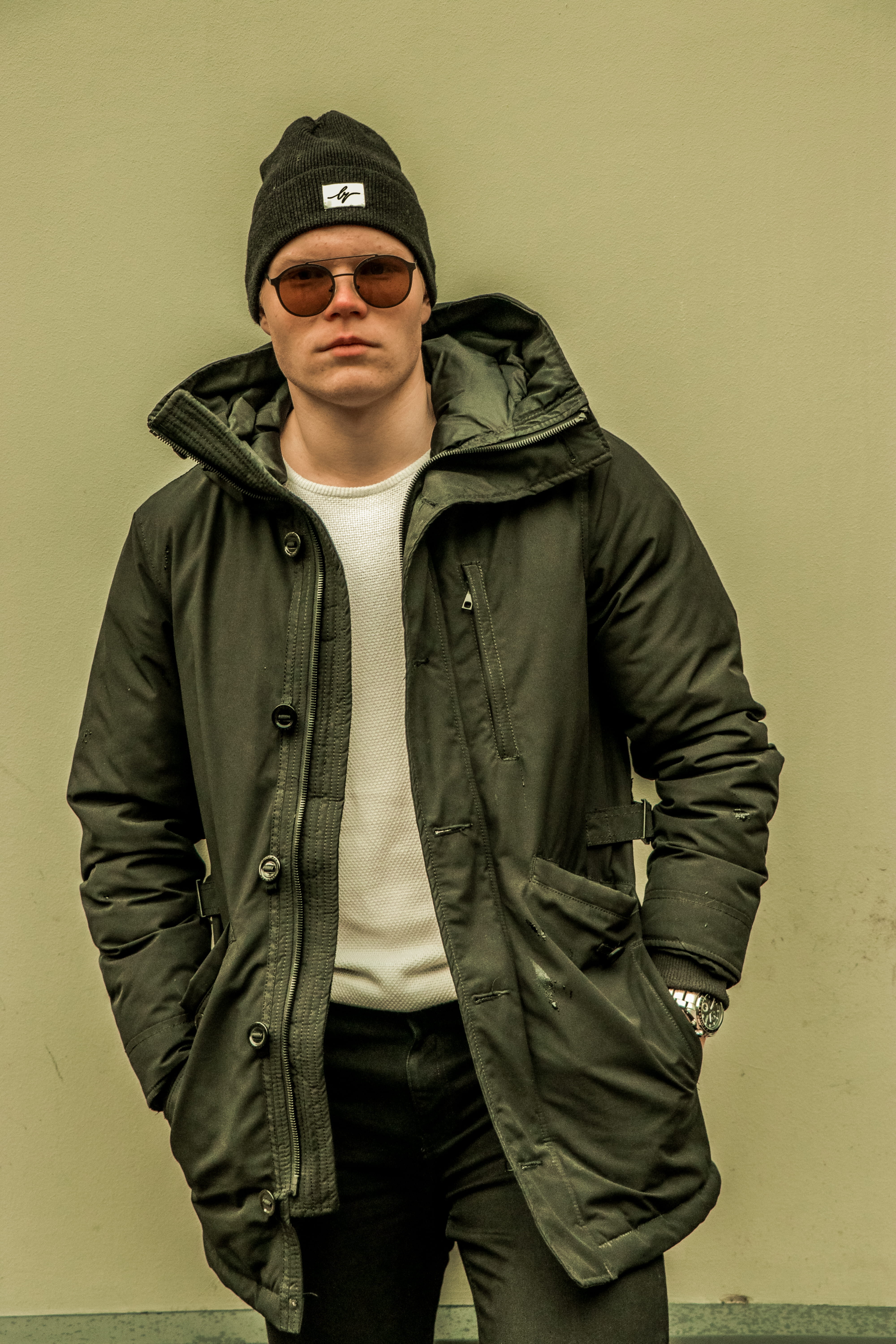 men, coat, clothing, warm clothing, hood - clothing, leather, hood, male, indoors, hands, 5K, real people, woman, pocket, black, wall, hat, portrait, model, Phone HD Wallpaper