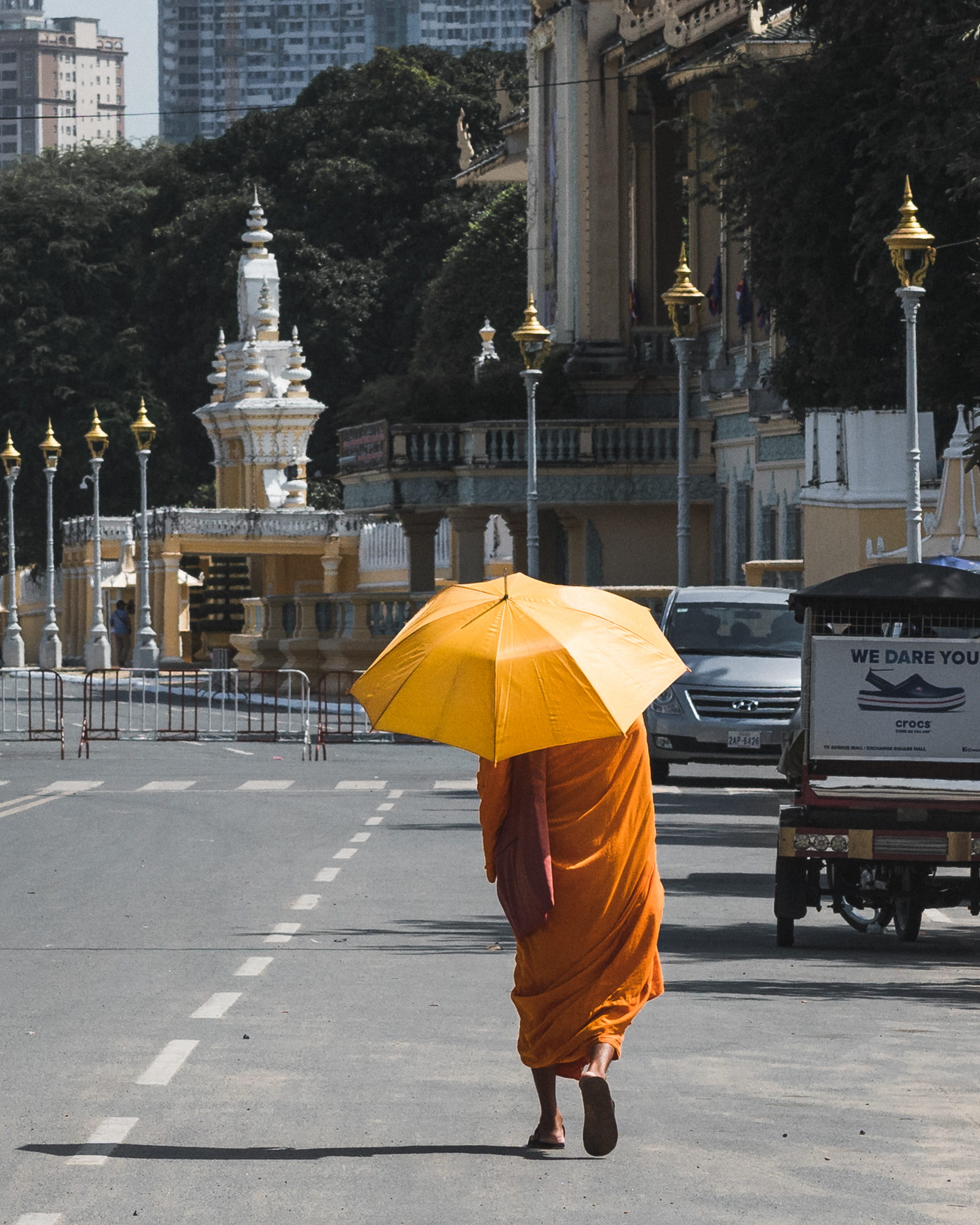 phnom penh, real people, religion, transportation, lifestyles, one person, mode of transportation, day, building exterior, buddhist, architecture, full length, Phone HD Wallpaper