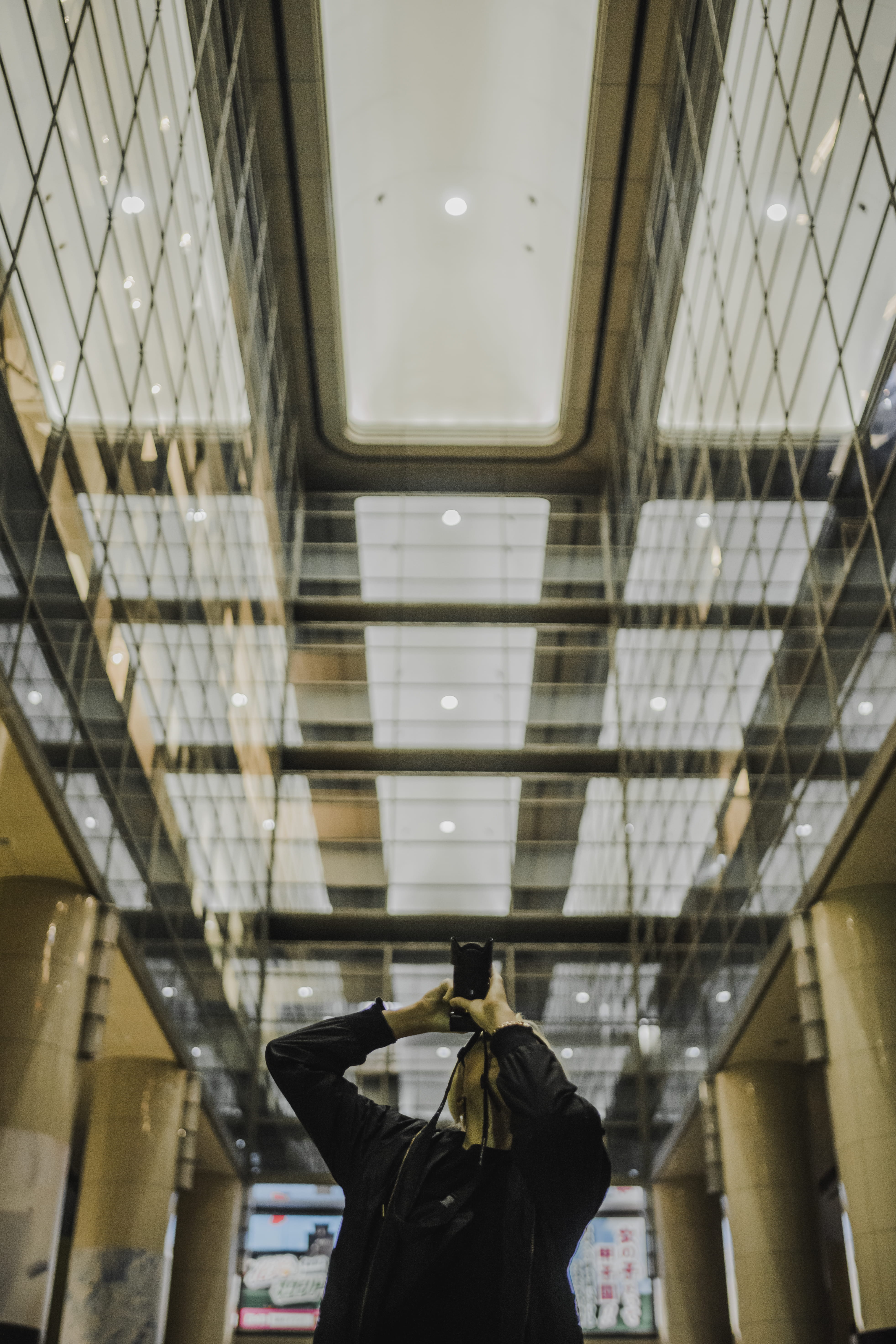 looking up, architecture, center, skylight, indoors, photo, ceiling, waist up, building, leisure activity, illuminated, one person, inside, people, mirror, Phone HD Wallpaper