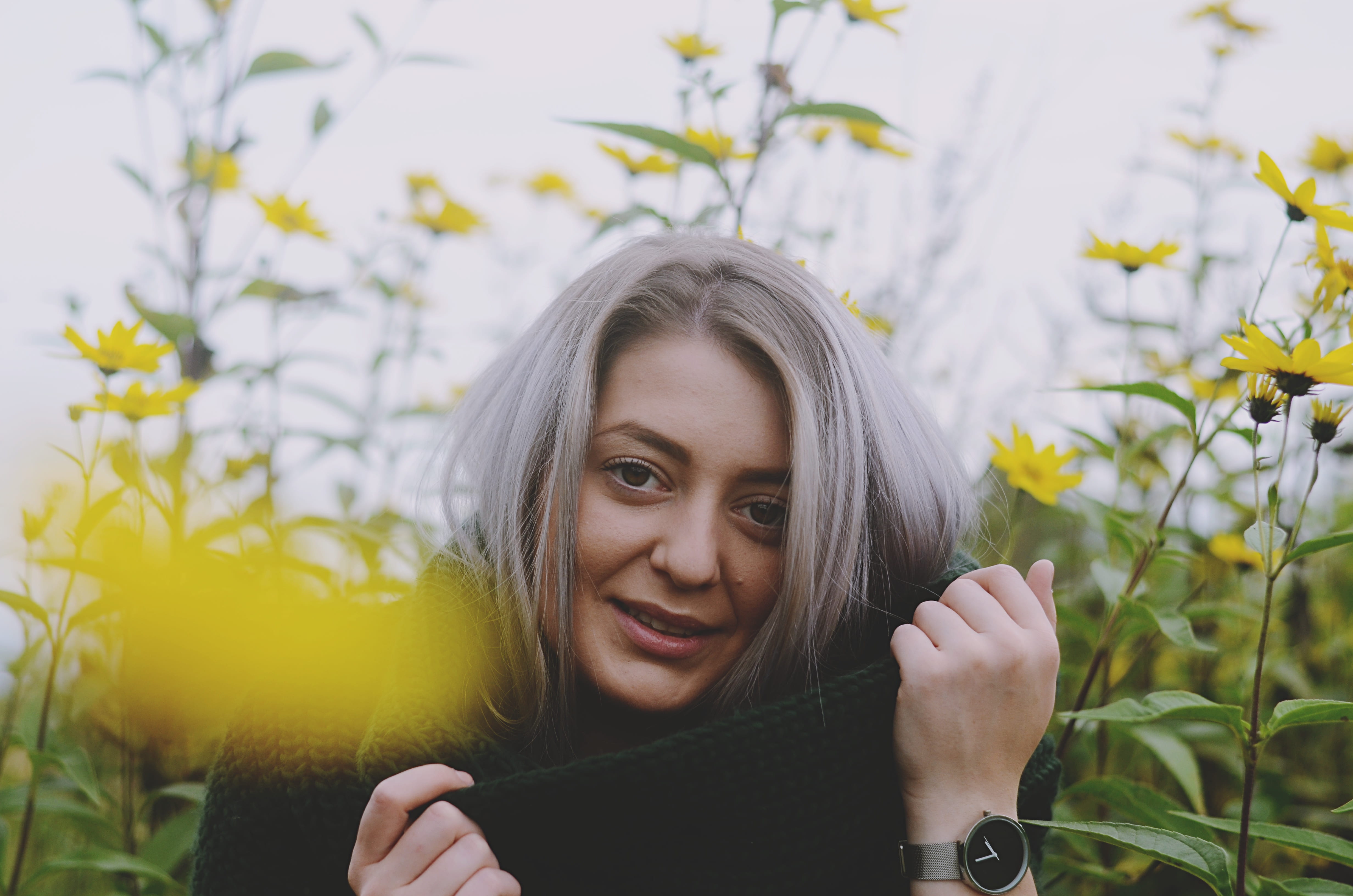 flowers, nature, one person, surrounded, smiling, headshot, young women, hands, chica, watch, beautiful woman, outdoors, female, happiness, young adult, HD Wallpaper