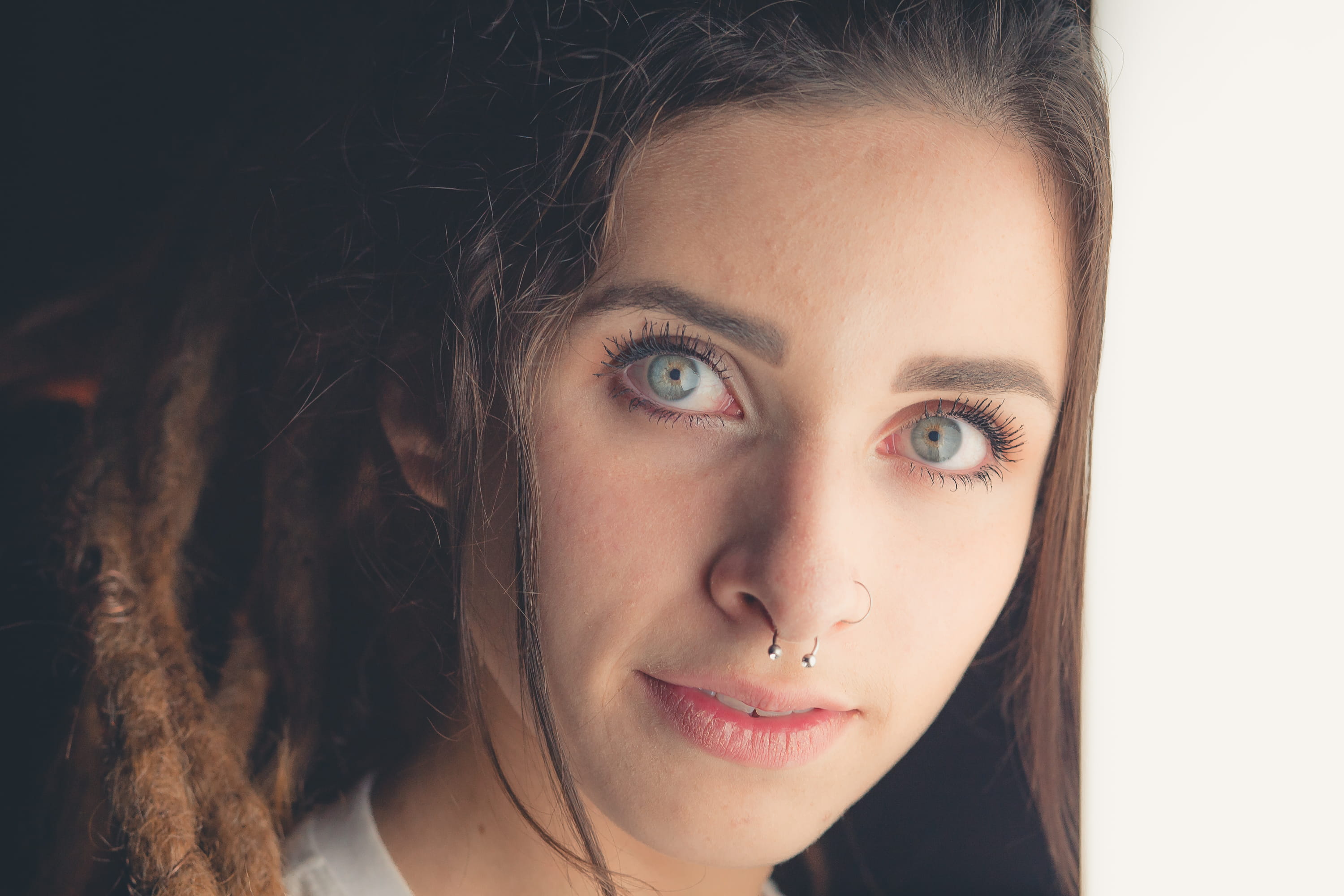 young adult, close up, dimples, glasses, close-up, front view, beautiful woman, 85mm, 2K, looking at camera, septum, lifestyles, contemplation, green eyes, HD Wallpaper