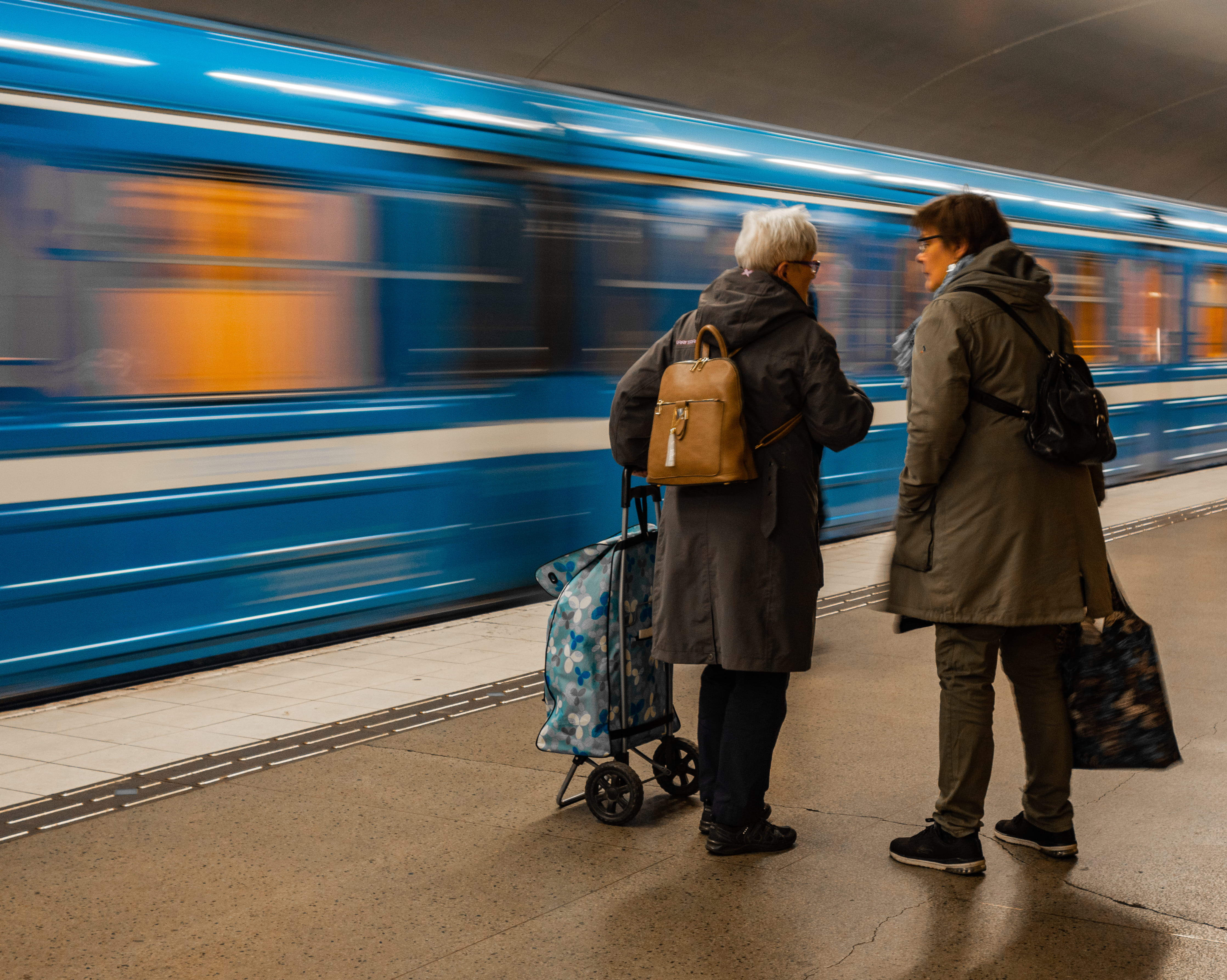 blurred motion, metro station, togetherness, slow shutter, adult, motion, two people, warm clothing, grand mothers, travel, grandma, subway train, metro, HD Wallpaper