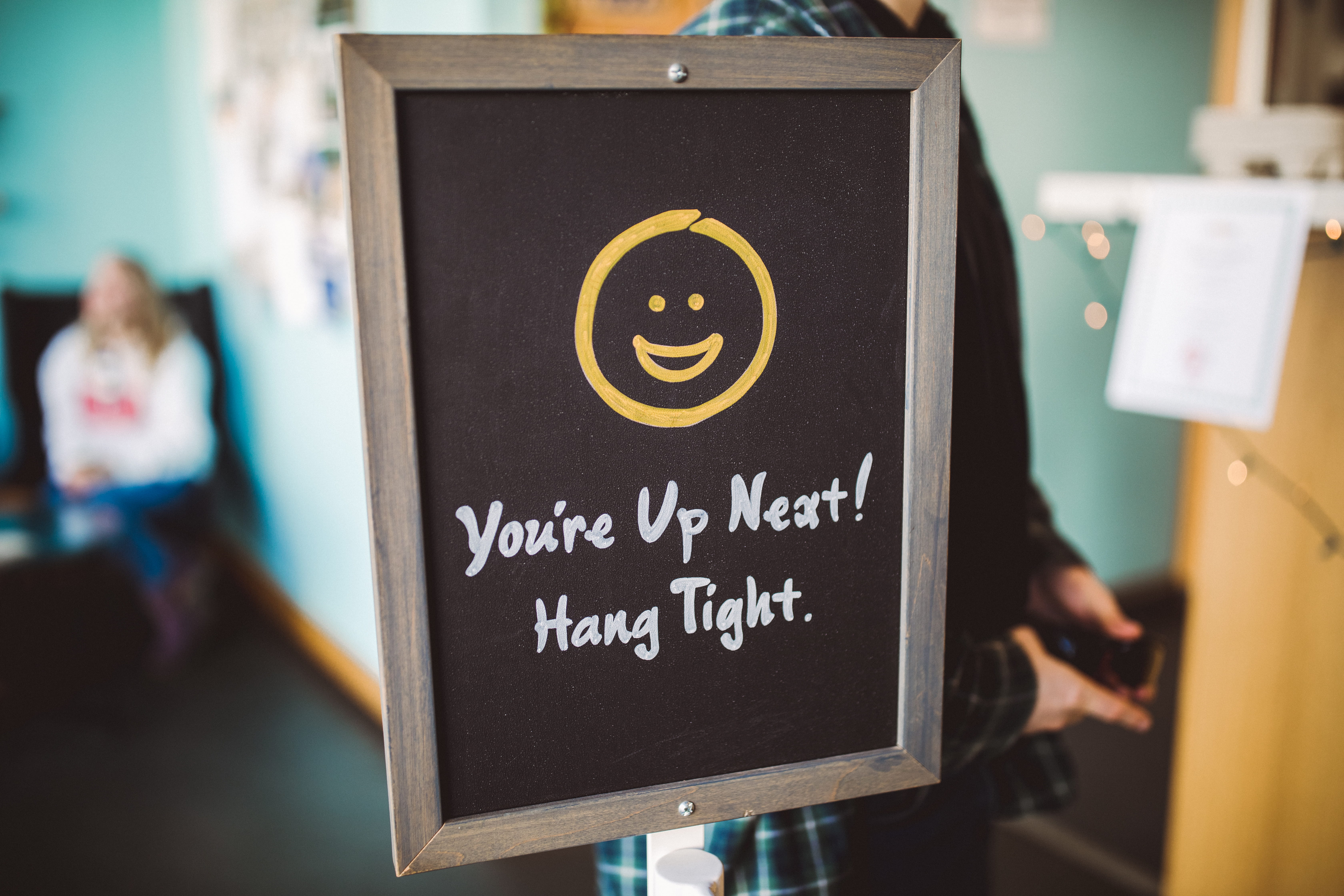 person, text, apparel, sign, human representation, logo, teacher, close-up, crowd, graduation, human, cafe, word, gold, emblem, wooden, 5K, photo booth, HD Wallpaper