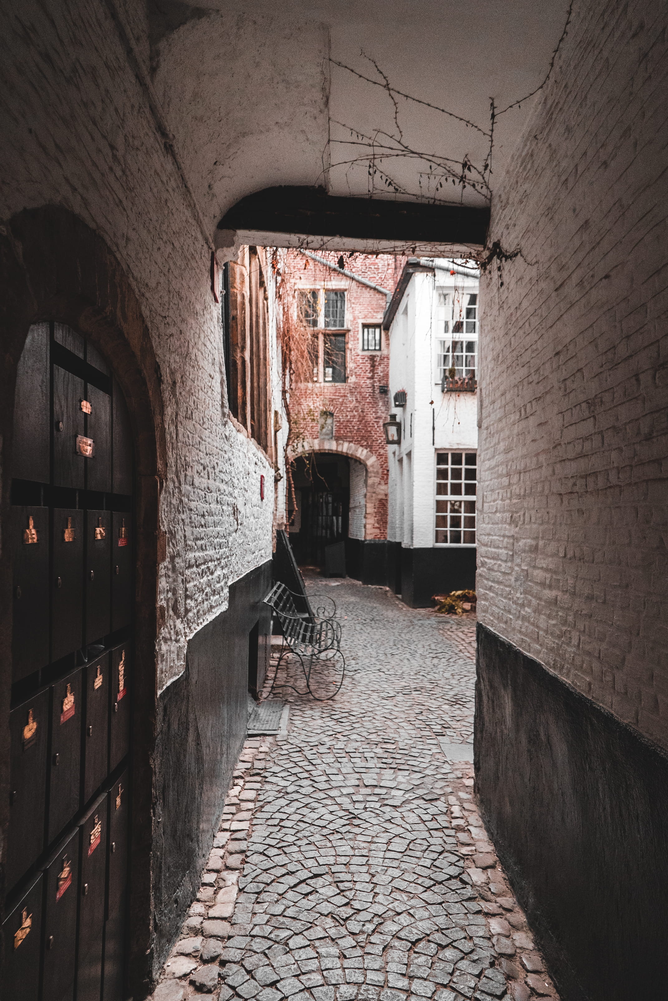 sidewalk, brick wall, walkway, stone wall, pavement, alley, corridor, cobblestone, belgië, path, no people, antwerpen, the way forward, empty, town, mailboxes, Phone HD Wallpaper