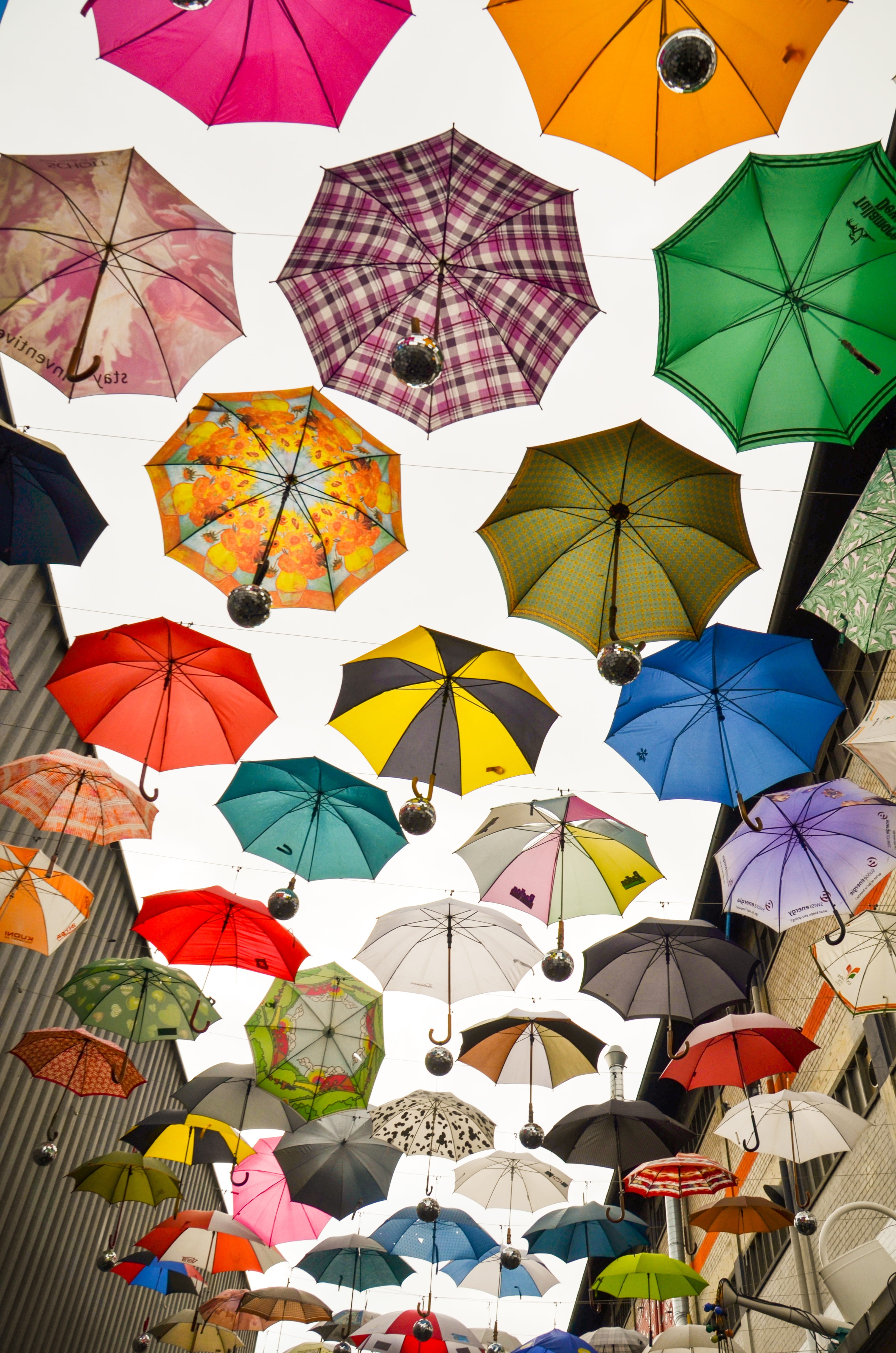 security, multi colored, color, variation, day, no people, funny, pattern, nature, creativity, low angle view, roof, architecture, hanging, zurich, parasol, Phone HD Wallpaper
