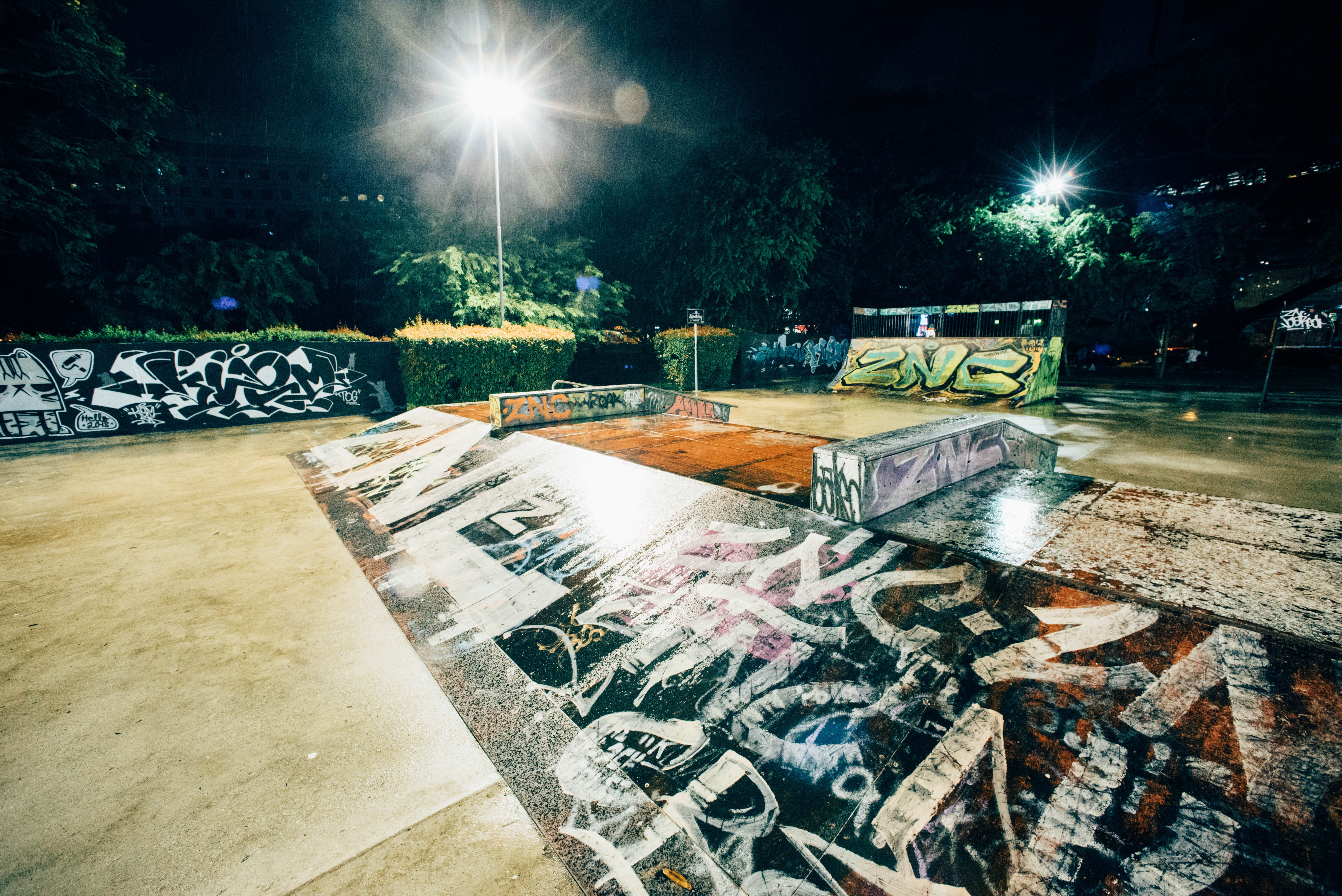 park - man made space, lens flare, cement, brick, built structure, plant, empty, skateboard park, seat, street, collage, grafitti, deck, street light, absence, HD Wallpaper