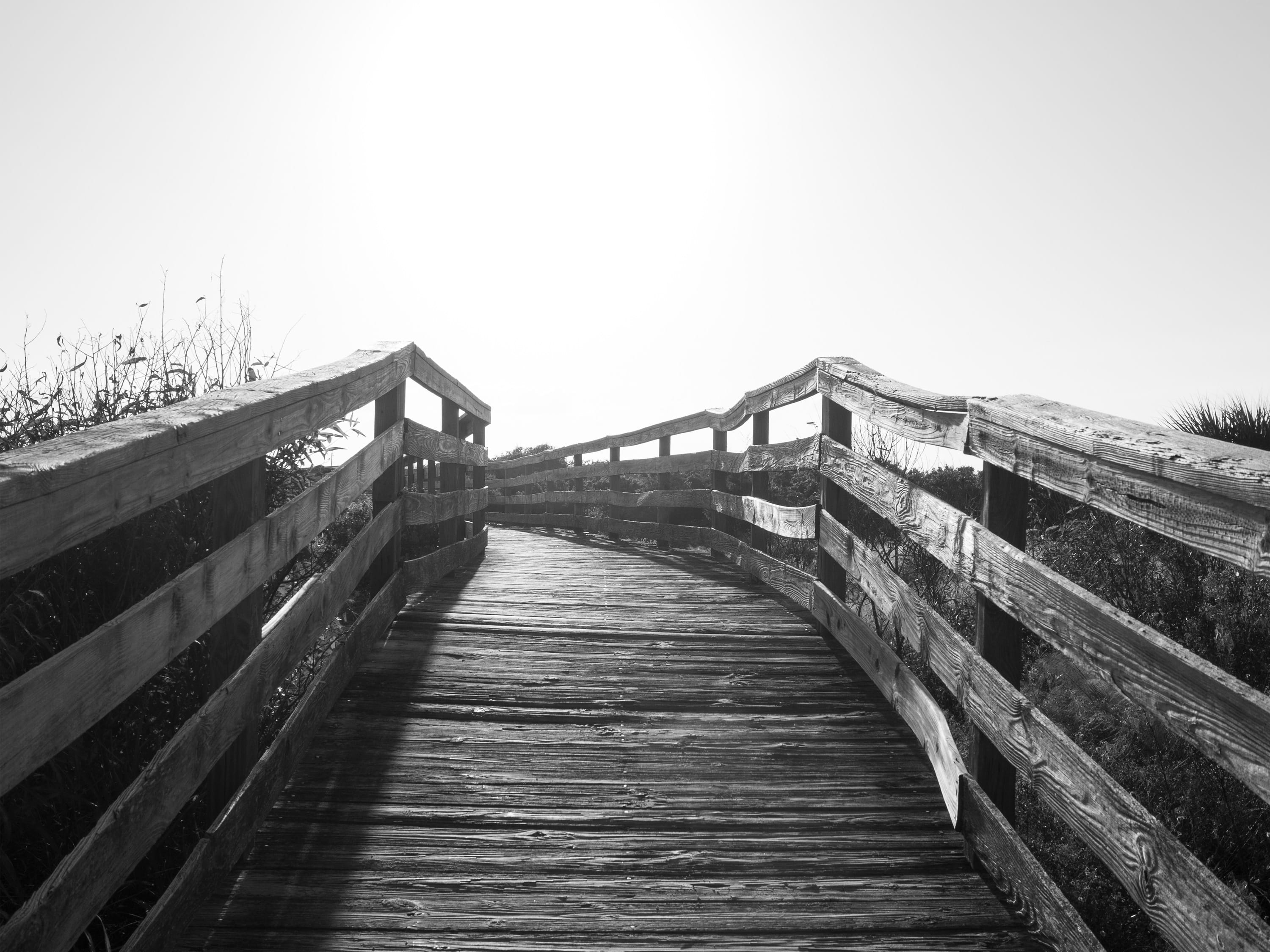 walkway, sunset, clear sky, railing, direction, wood, black and white, high key, tranquility, beach, wood - material, architecture, bridge - man made structure, HD Wallpaper