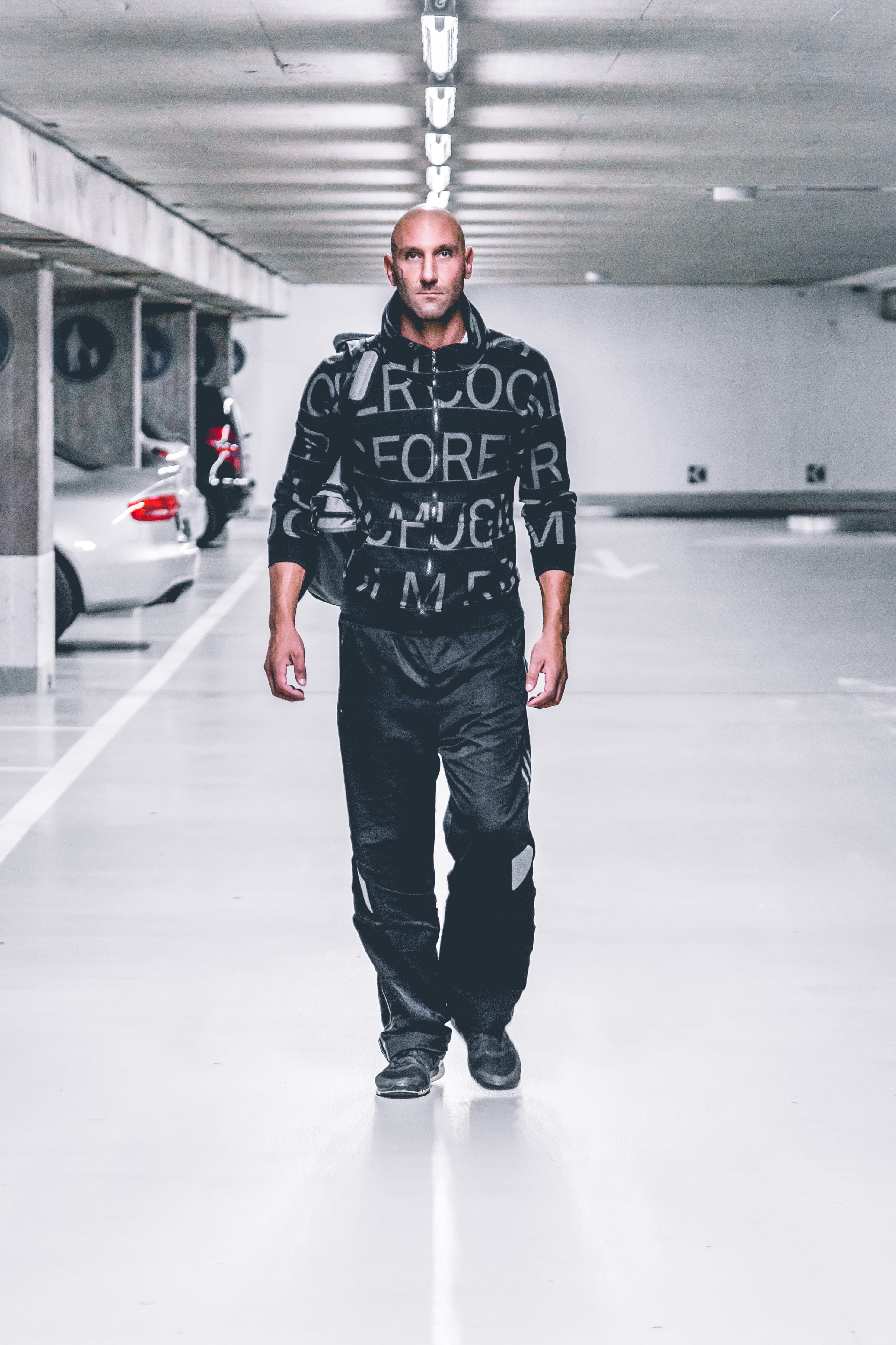 facial expression, fine-looking, parking deck, standing, fashion, mode of transportation, zip, wear, young men, pants, urban, looking at camera, full length, Phone HD Wallpaper