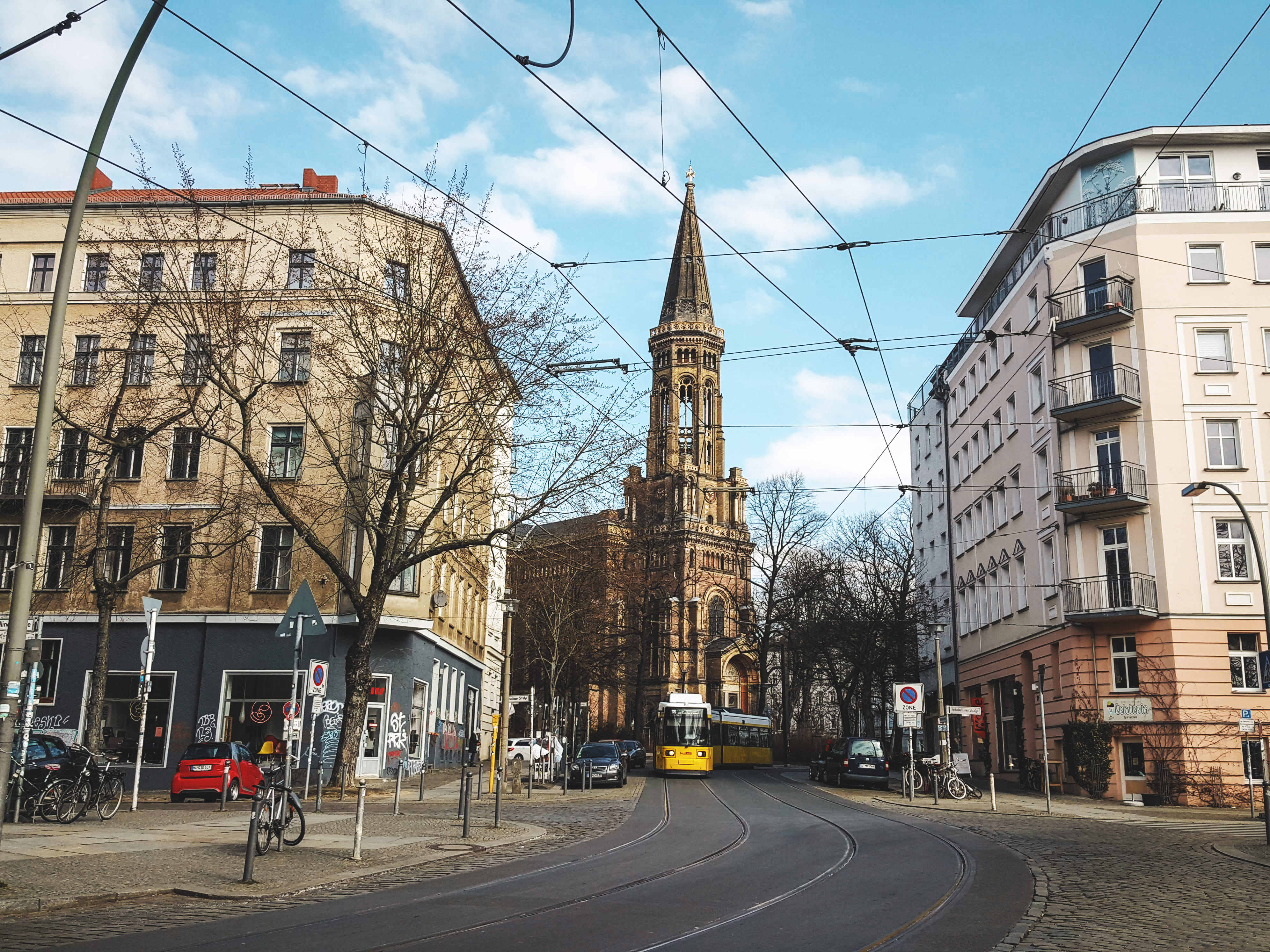 church, berlin, tramway, blue sky, sign, europe, residential district, yellow, land vehicle, architecture, bare tree, germany, city, tram, road, old city, HD Wallpaper