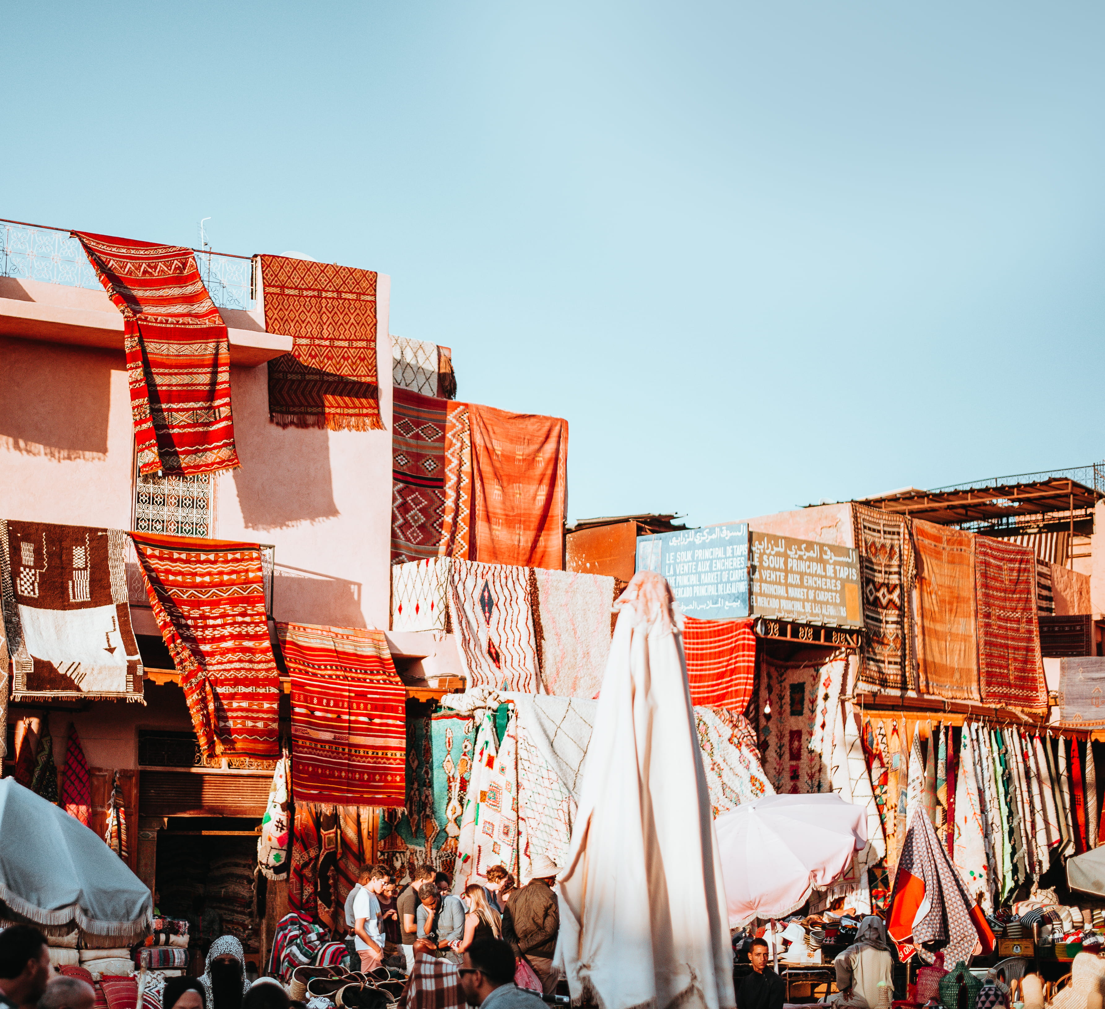 architecture, nature, 2K, flag, hanging, city, men, middle east, built structure, market, textiles, large group of people, market stall, clear sky, banket, HD Wallpaper
