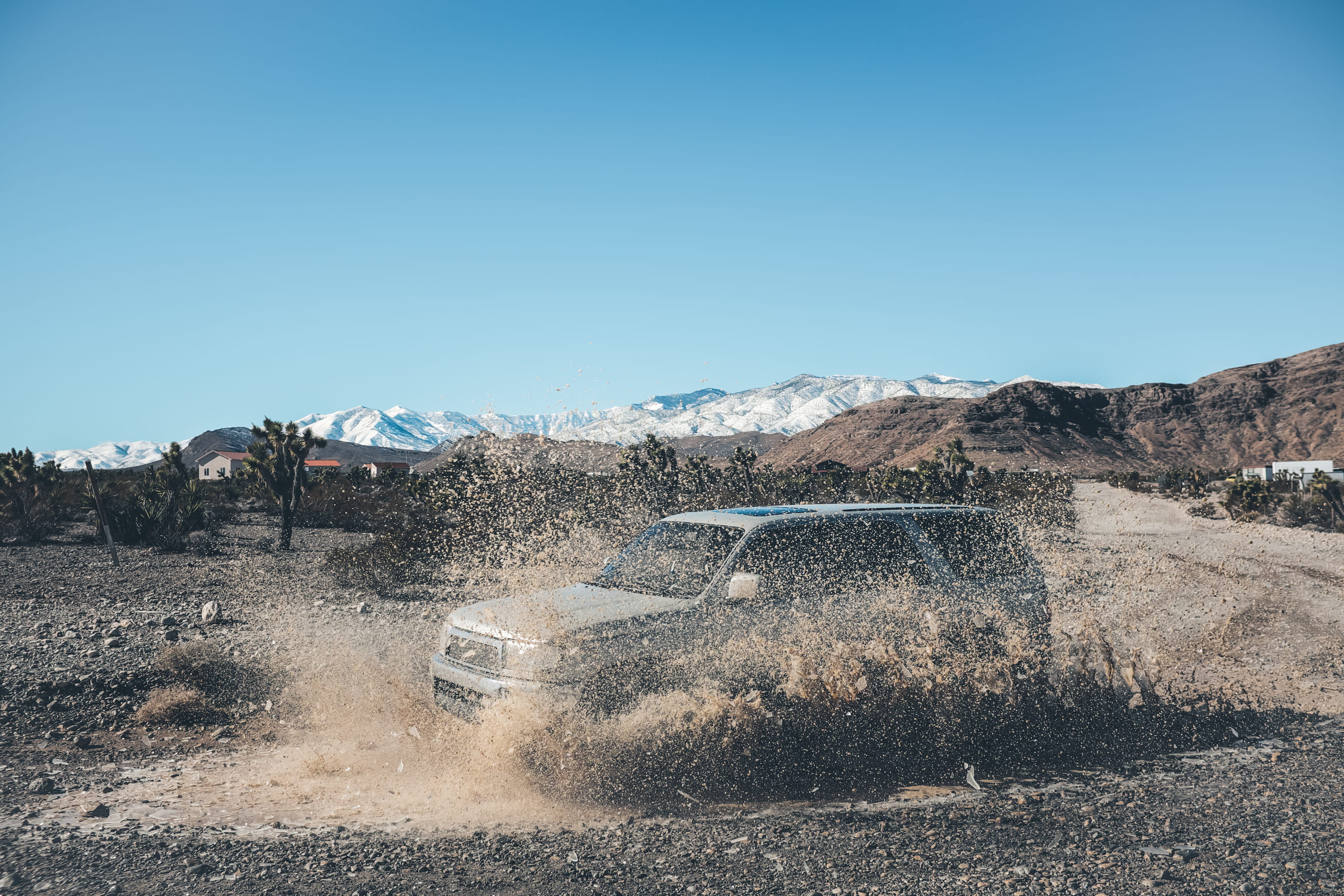 water, no people, offroading, 2K, dust, motor vehicle, desert, clear sky, mud, blue, off road, motion, transportation, road, mountain, mode of transportation, HD Wallpaper