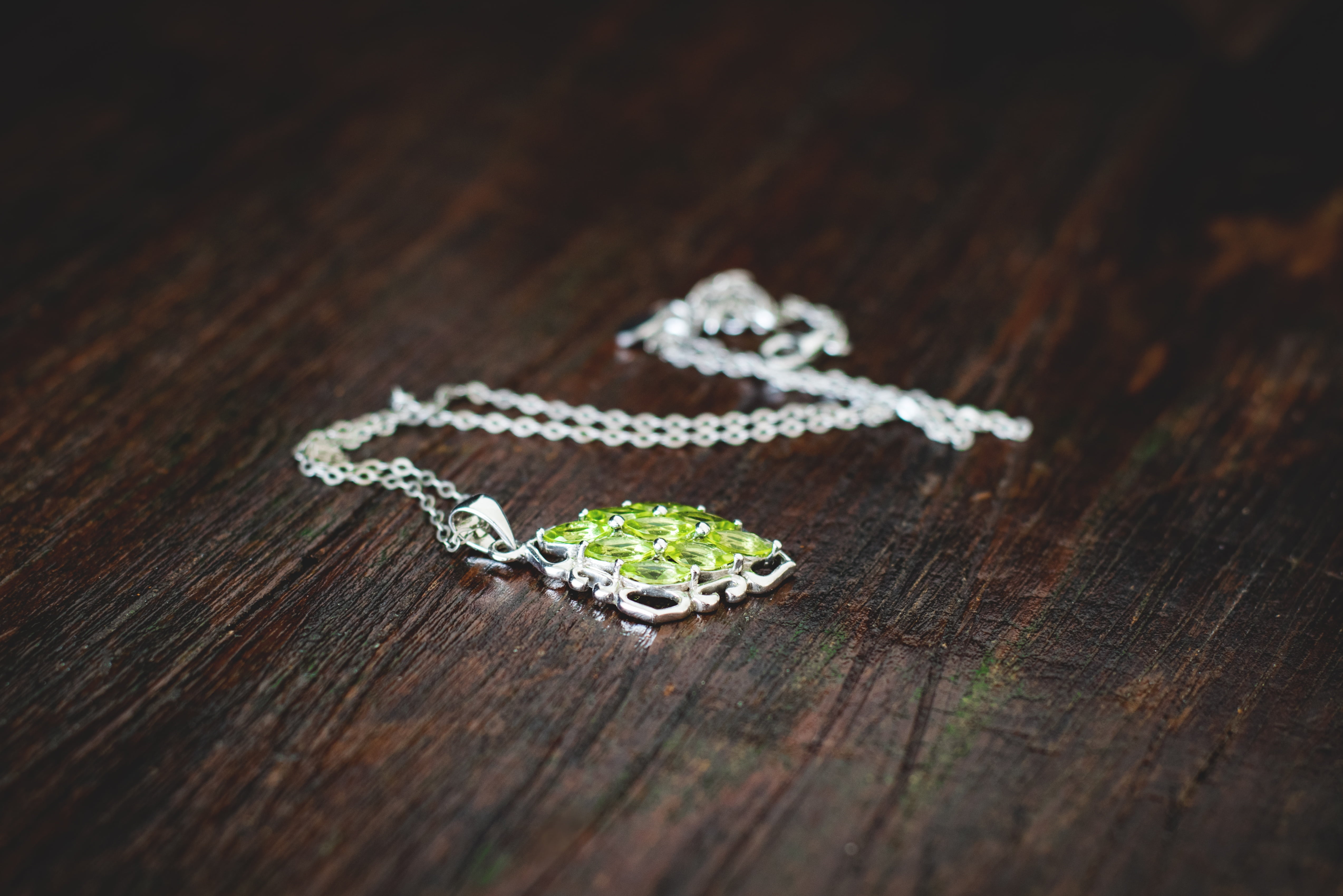 table, day, ring, wood - material, two objects, gemstone, indoors, metal, peridot, sparkle, selective focus, high angle view, shiny, jewel, close-up, pendant, HD Wallpaper